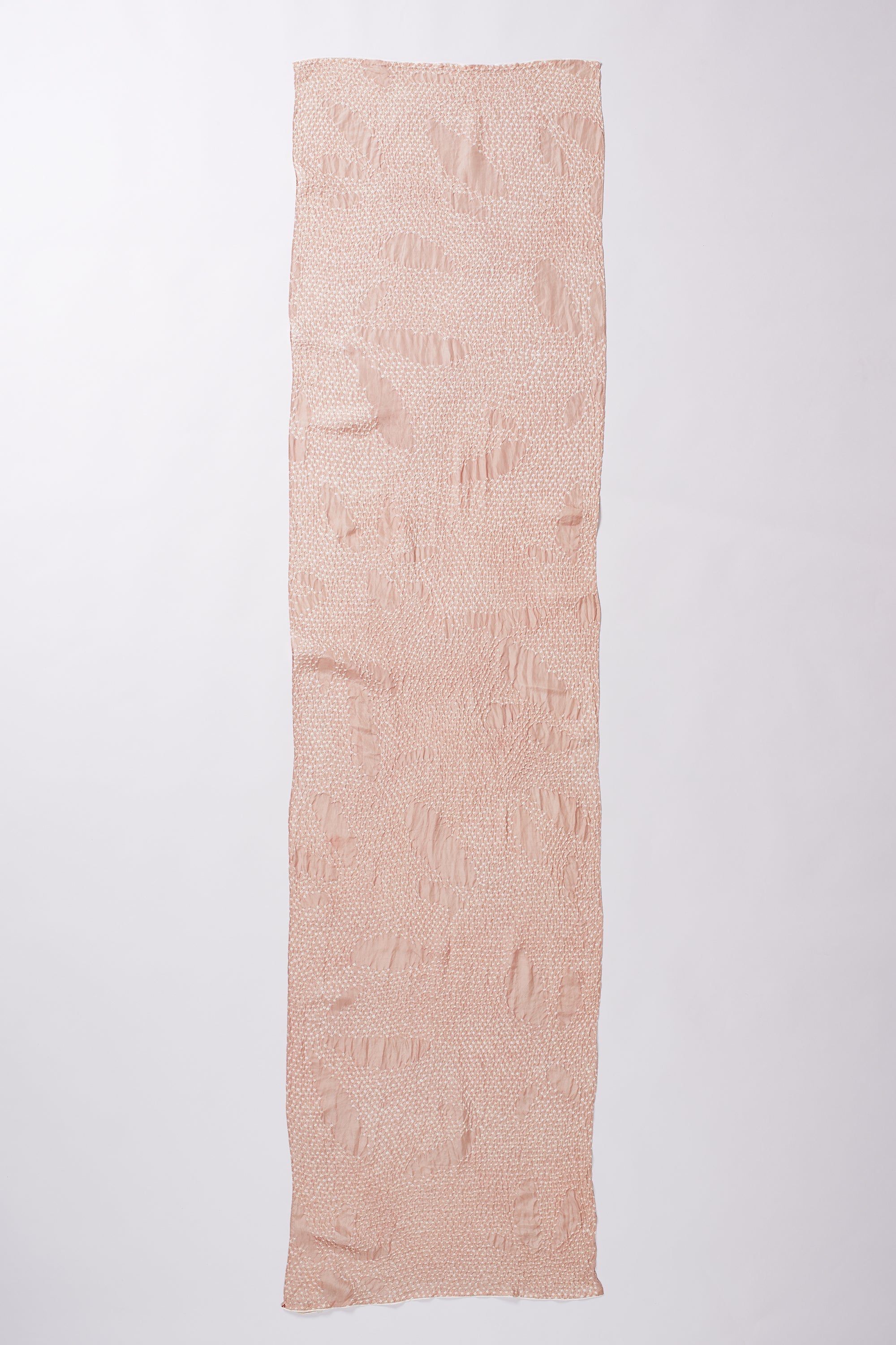Long rectangular piece of light pink fabric