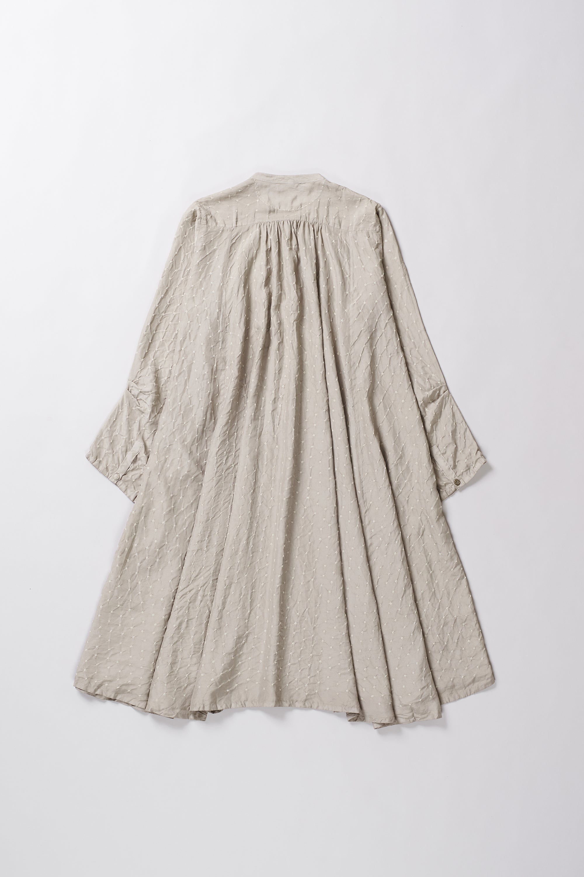 Beige dress with a long skirt and long sleeves