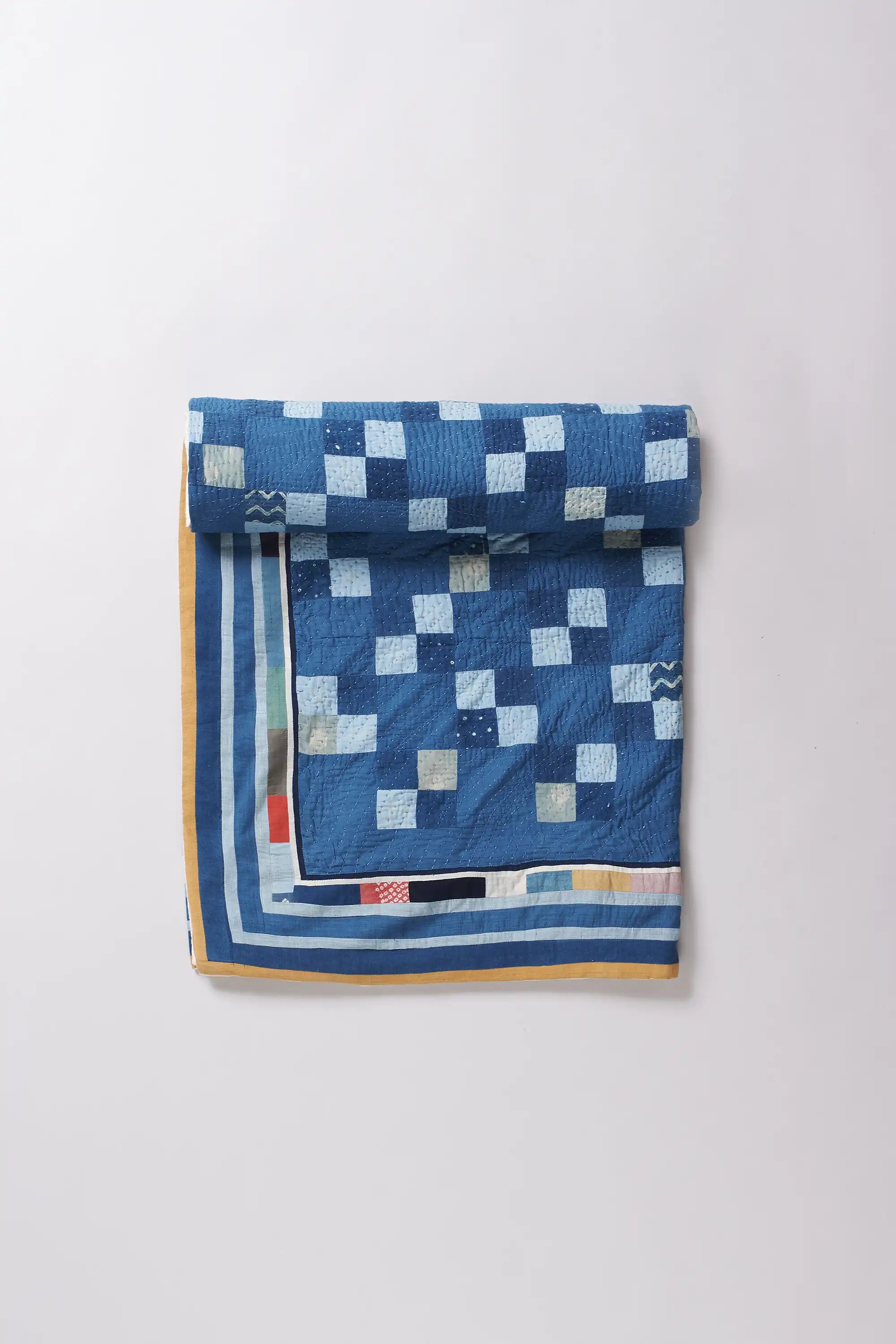 Folded fabric with geometric pattern on a white background