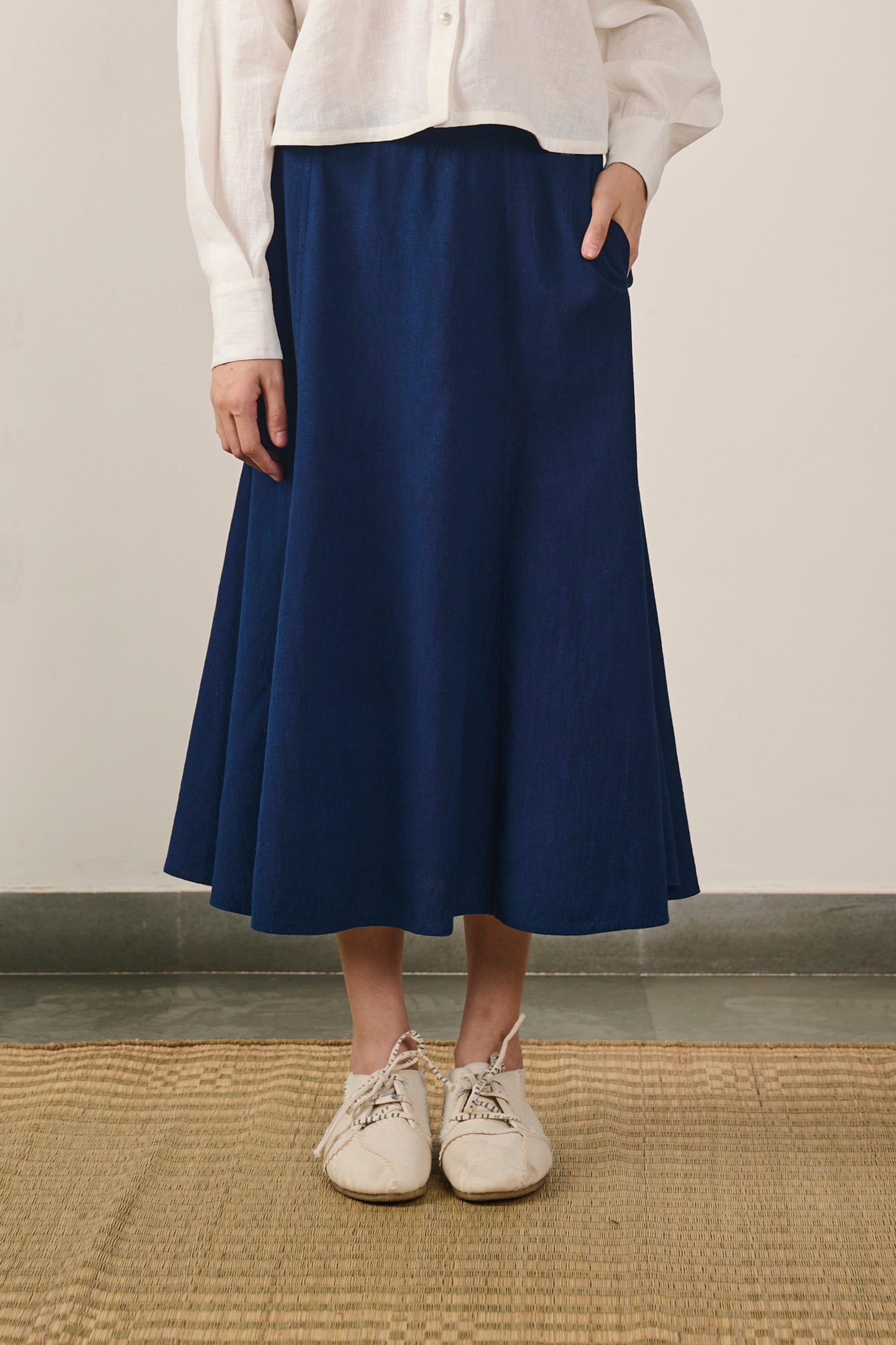 A woman wearing indigo cotton skirt