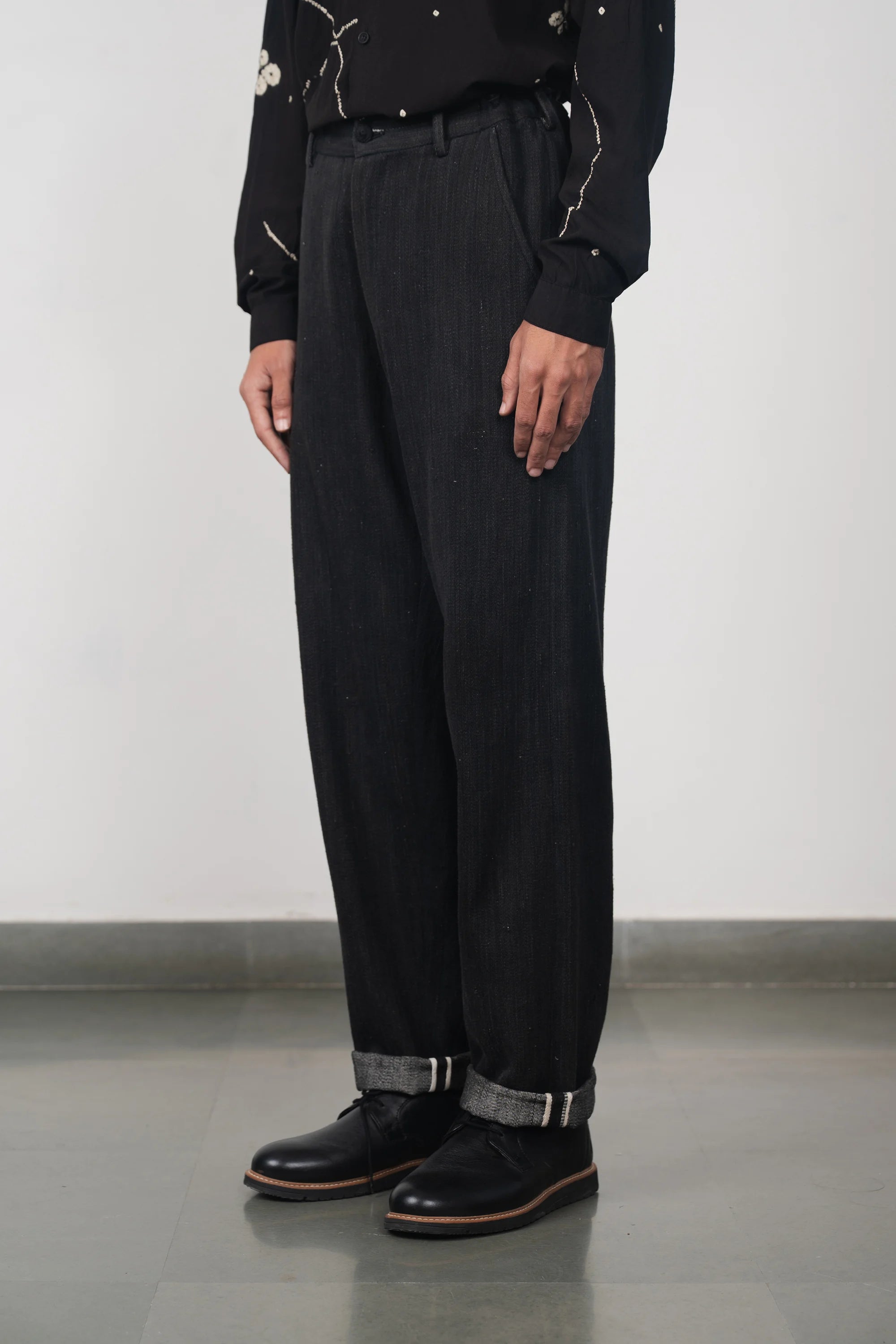 A man wearing medium indigo denim pant