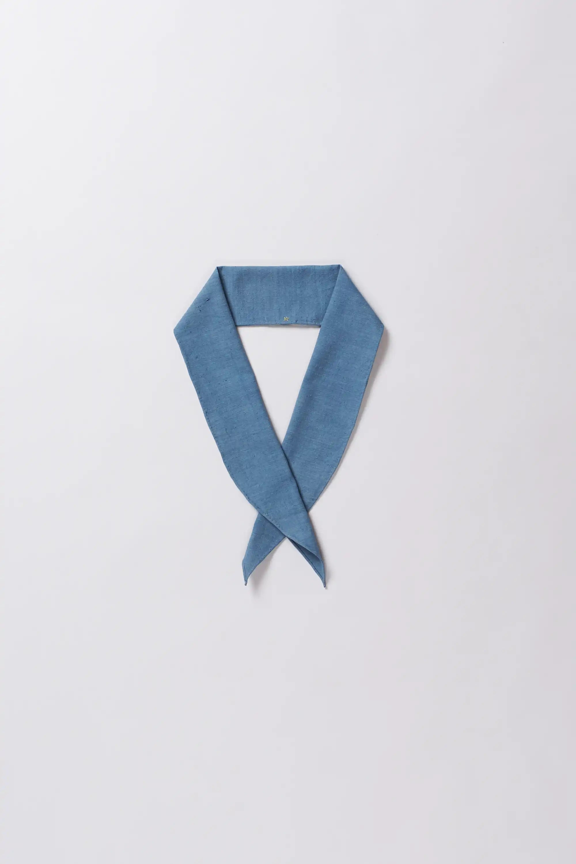 Blue cotton scarf on a light gray background