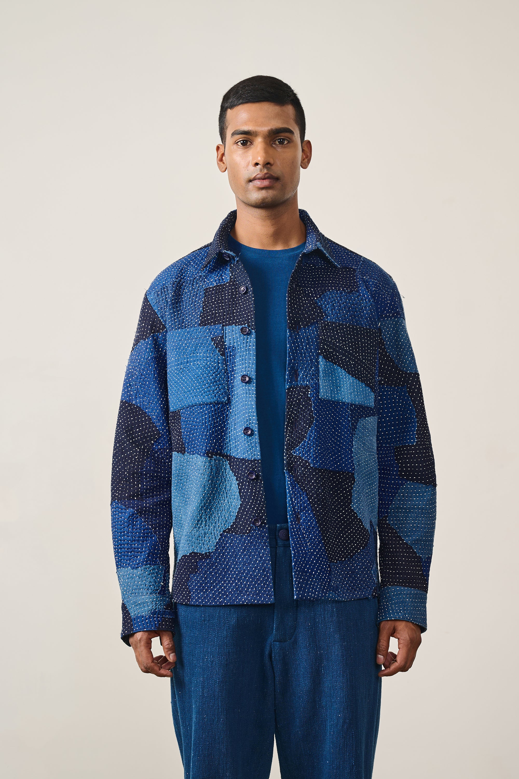 A man wearing ecru shirt