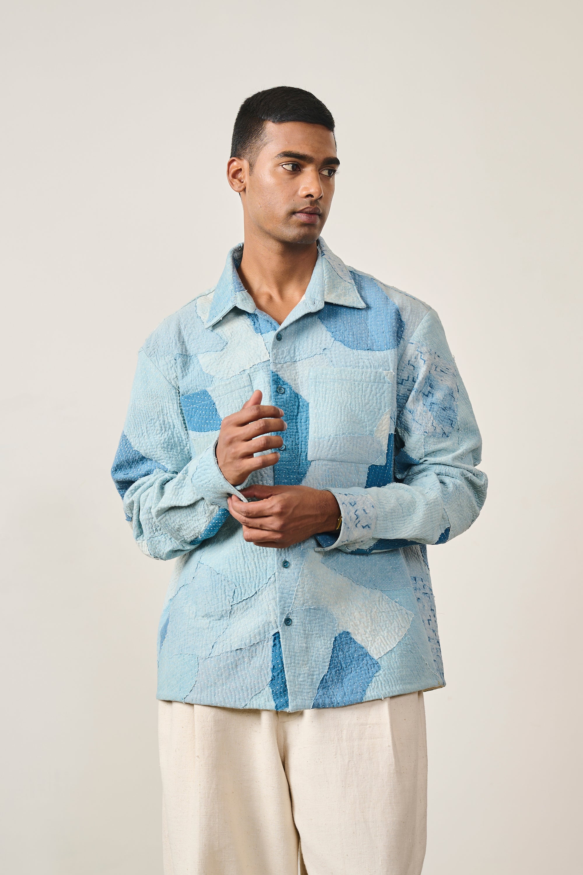 Close-up shot of a man wearing sky indigo cotton shirt with patchwork