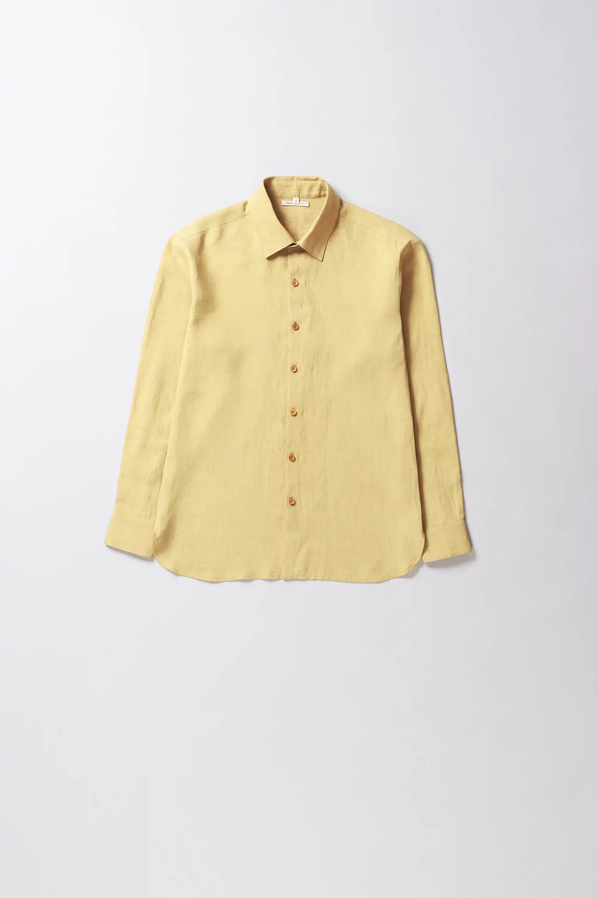 Yellow shirt collar on a light grey background