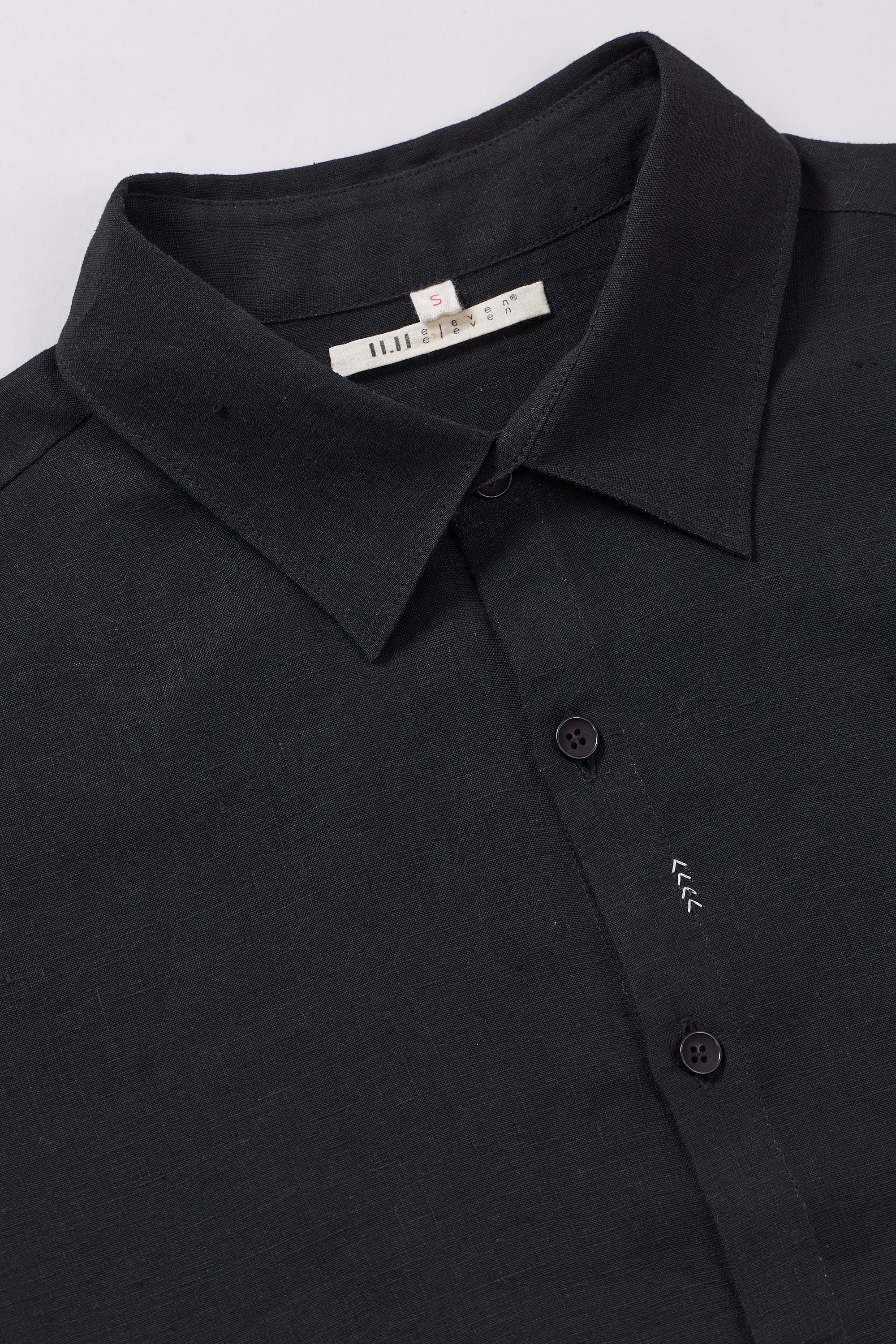 Fabric close-up with buttons and collar