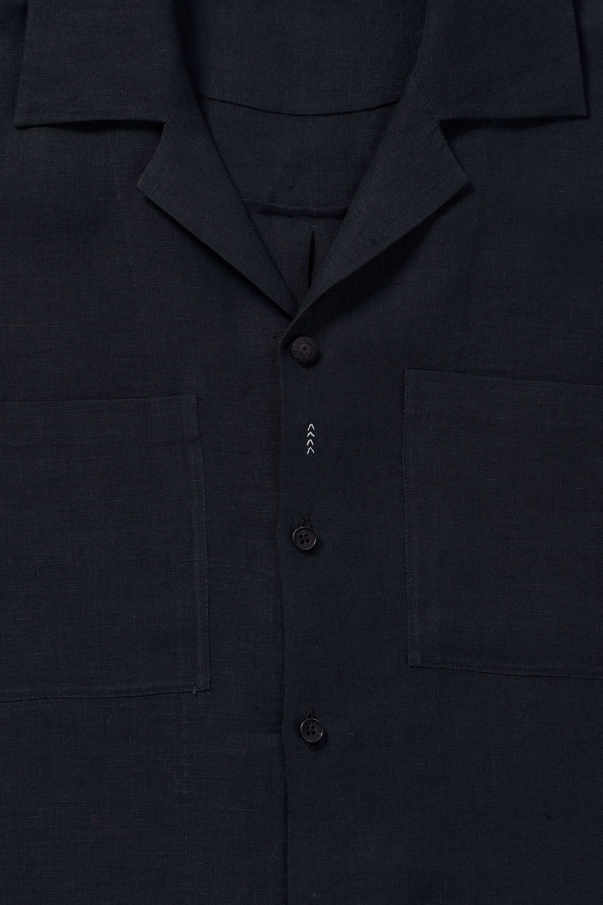 Fabric close-up with button and collar