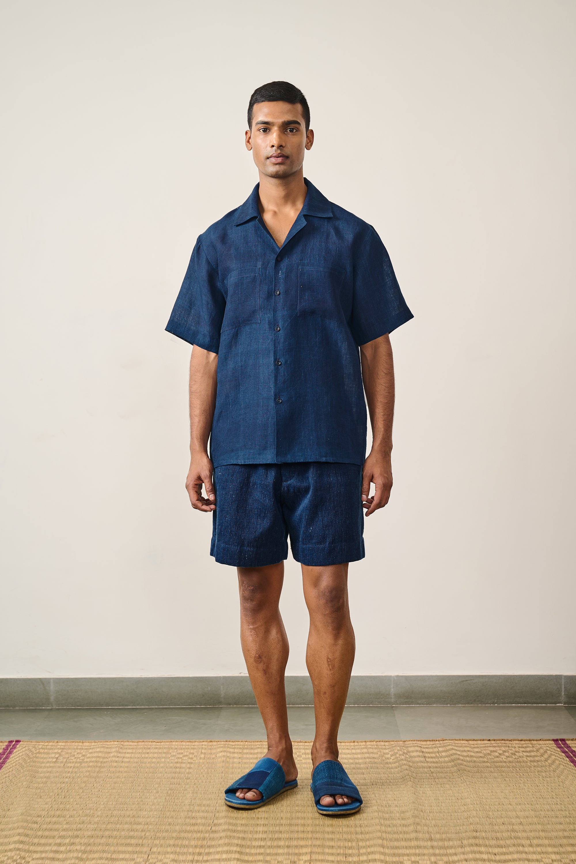A man wearing indigo shirt