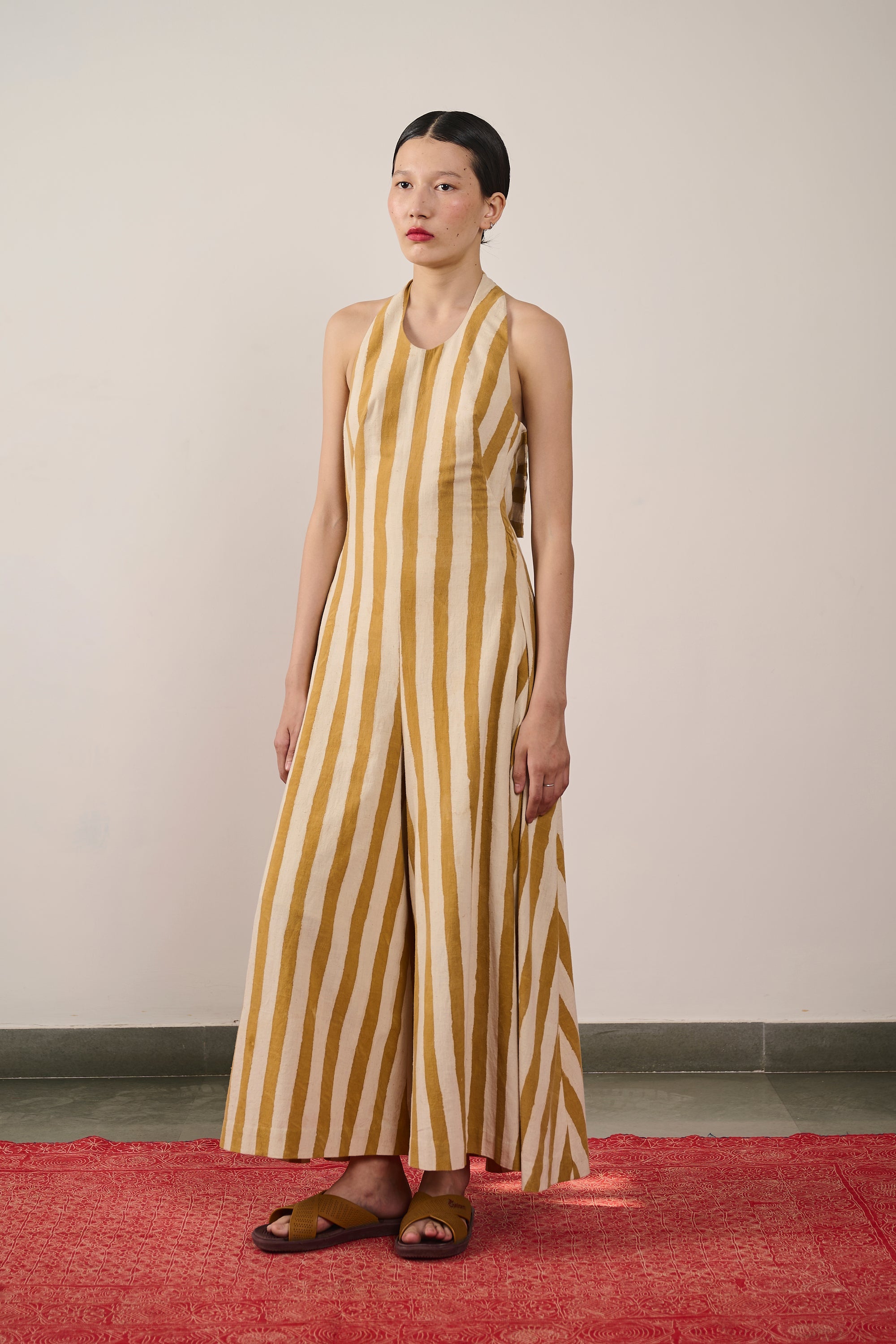 A woman wearing mustard yellow cotton dress