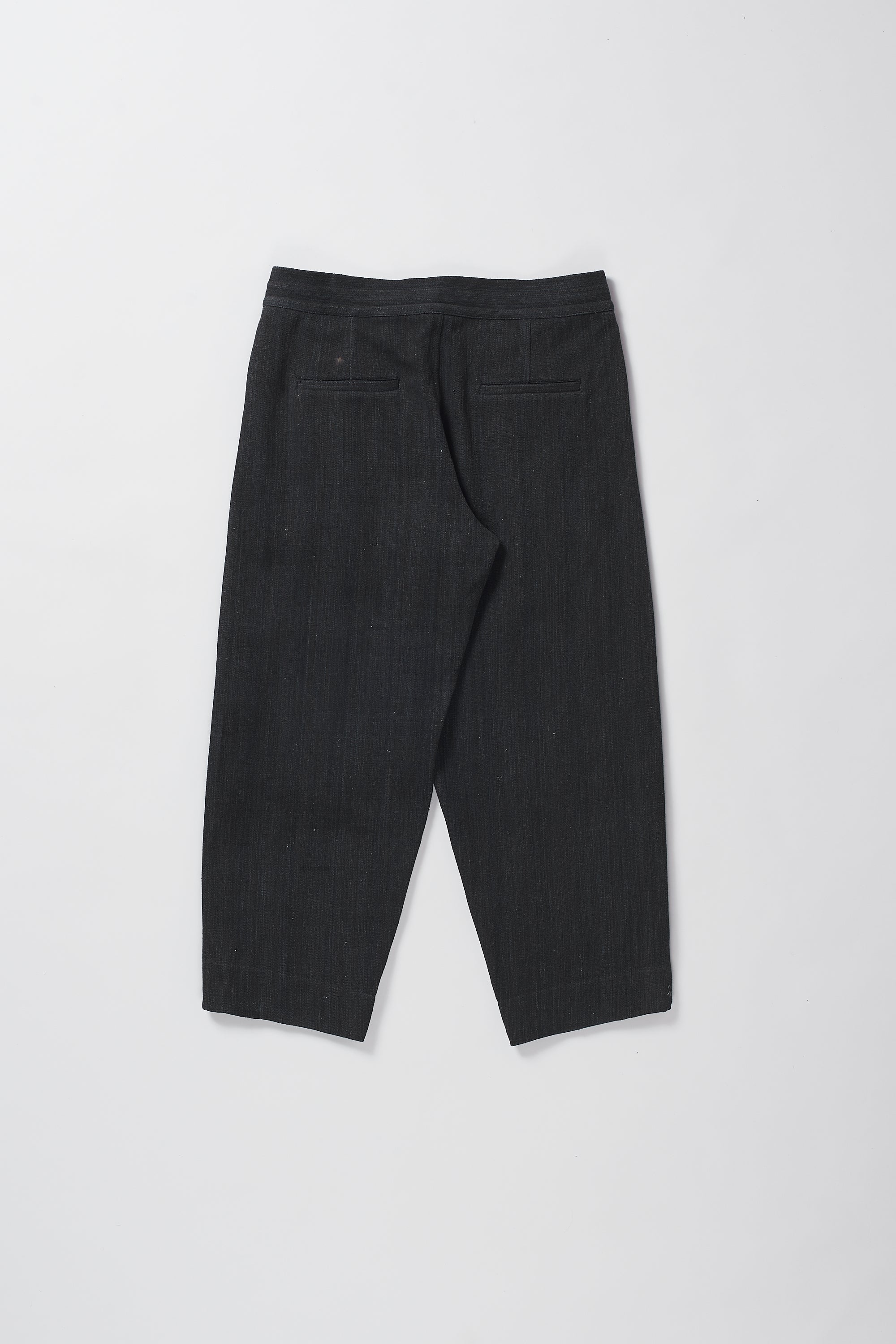 Back image of a midnight indigo denim pant