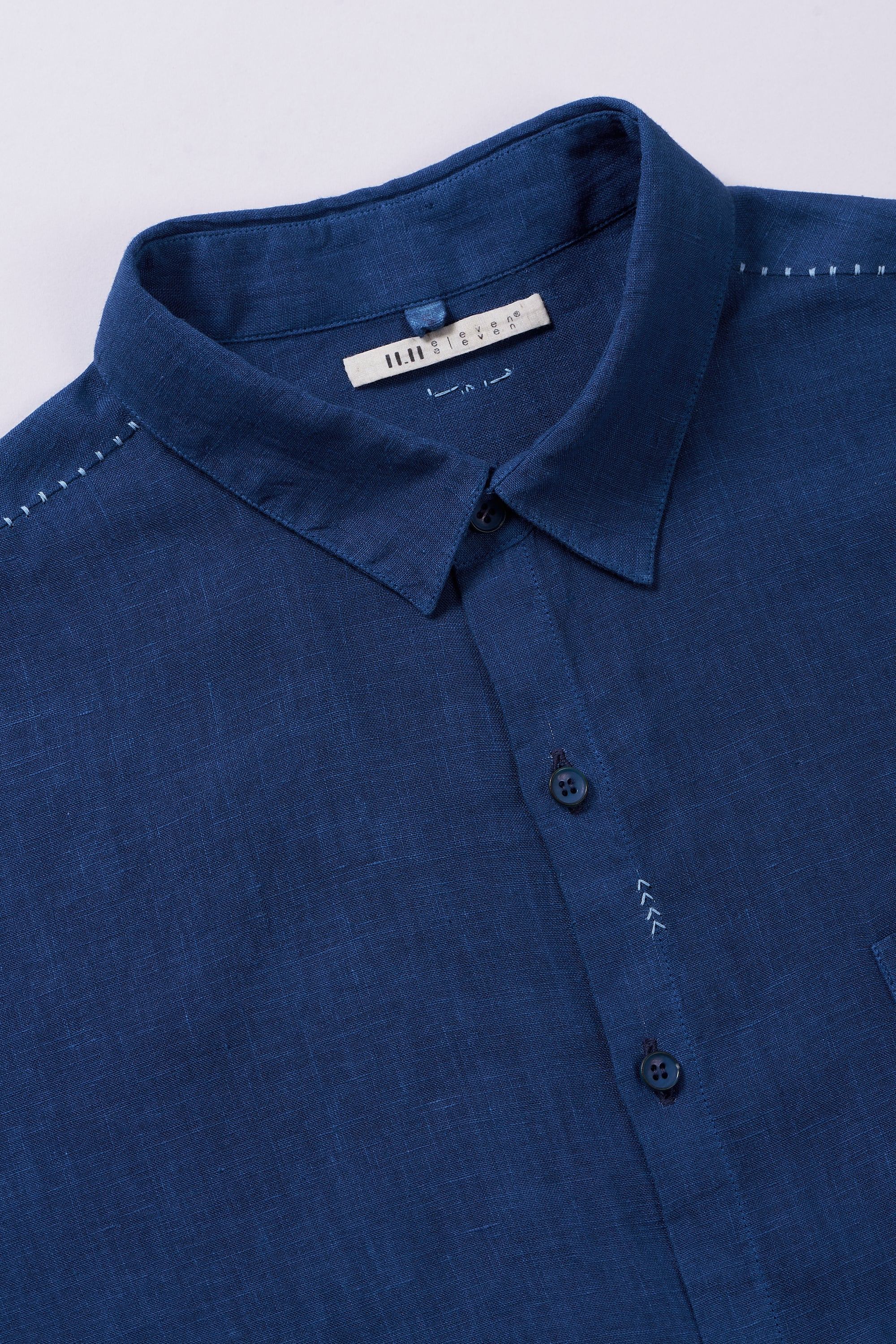 Fabric close-up with buttons and collar