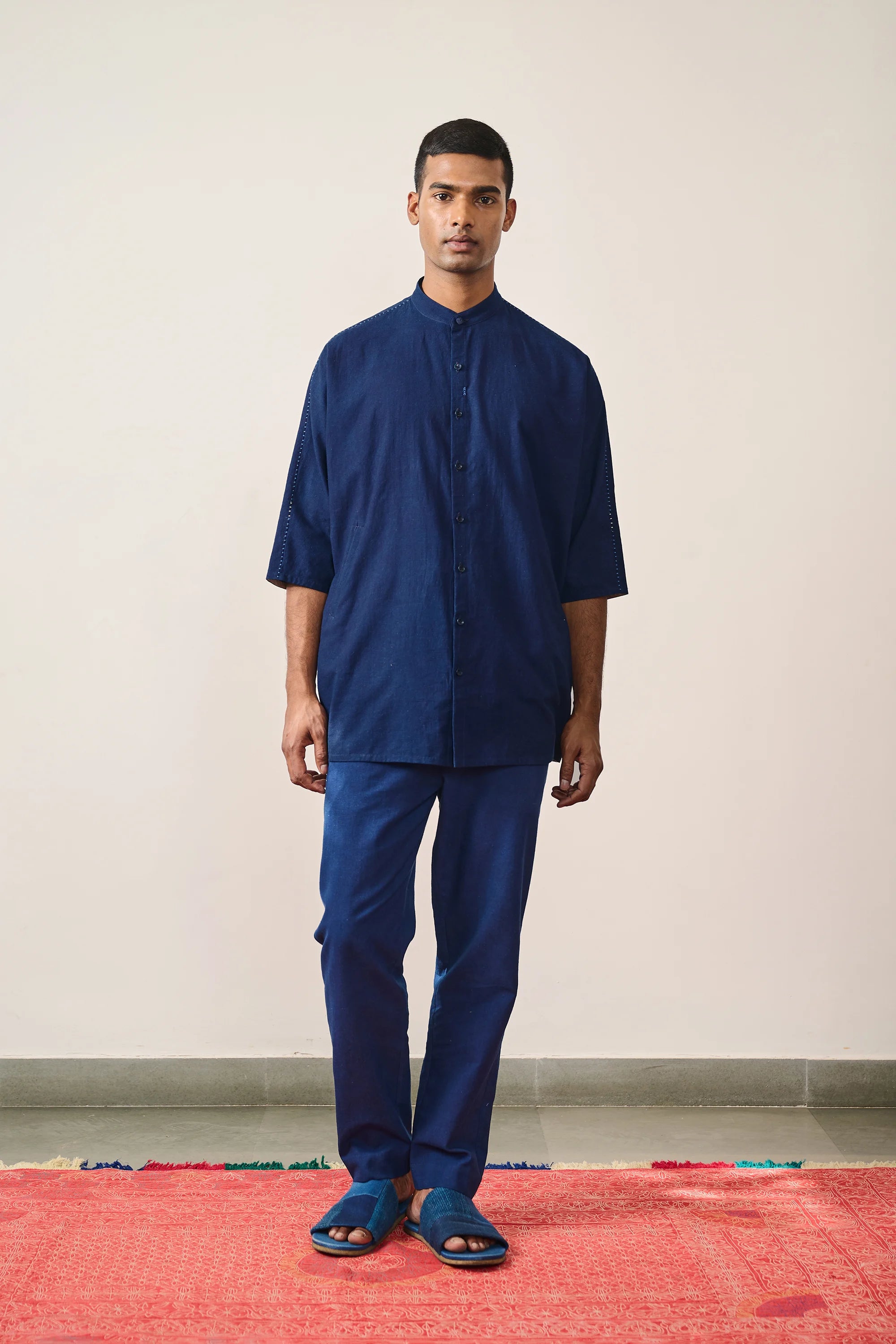 A man wearing indigo cotton shirt