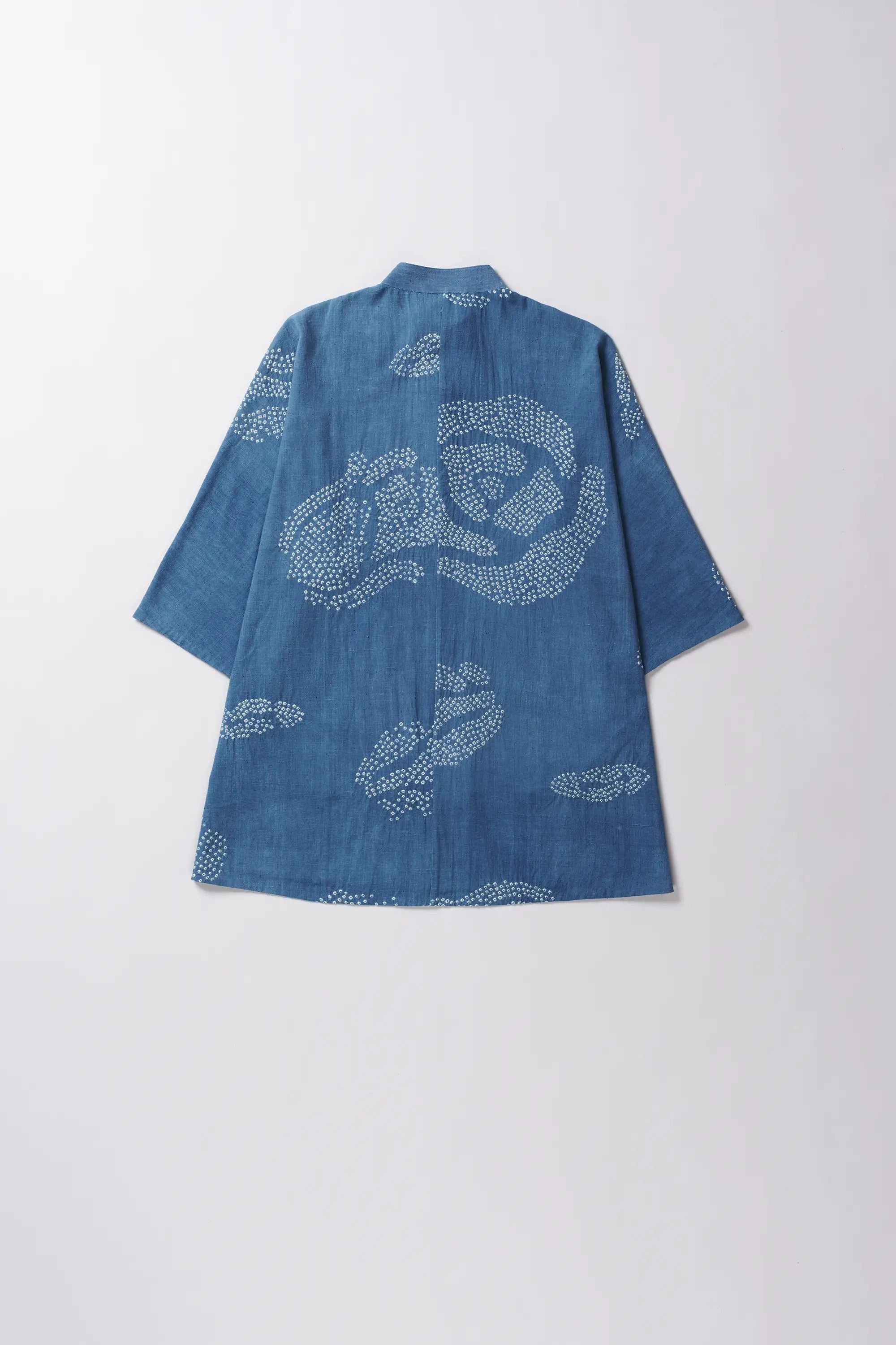 Blue cotton shirt with bandhani on a light grey background