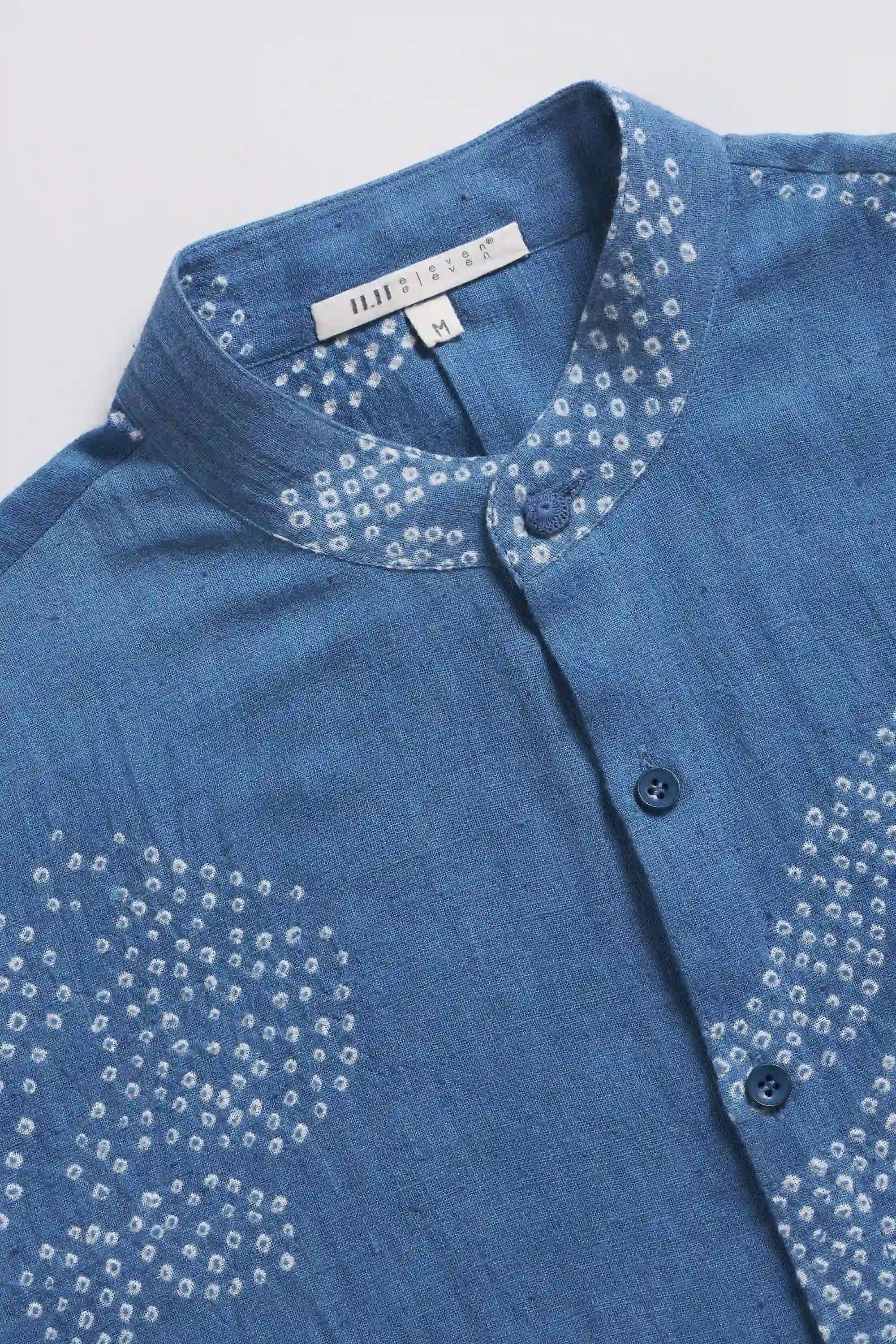 Fabric close-up with band collar and buttons 