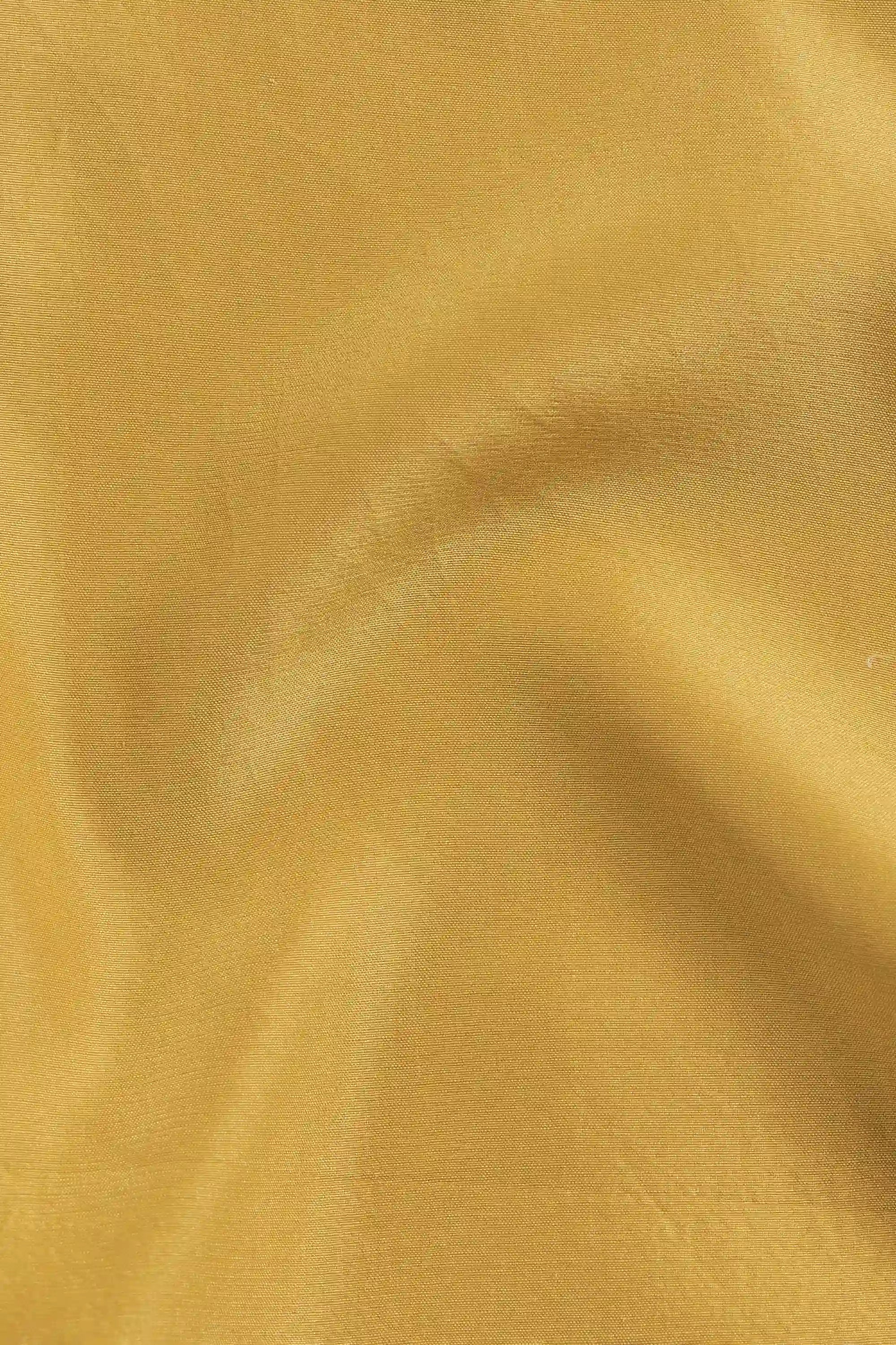 Close-up of a ochre yellow fabric 