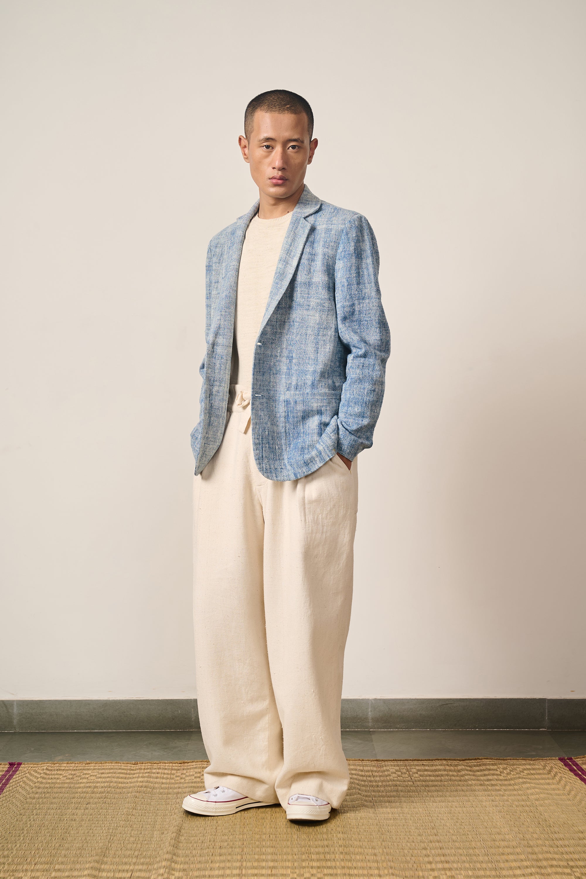 A man wearing medium indigo jacket