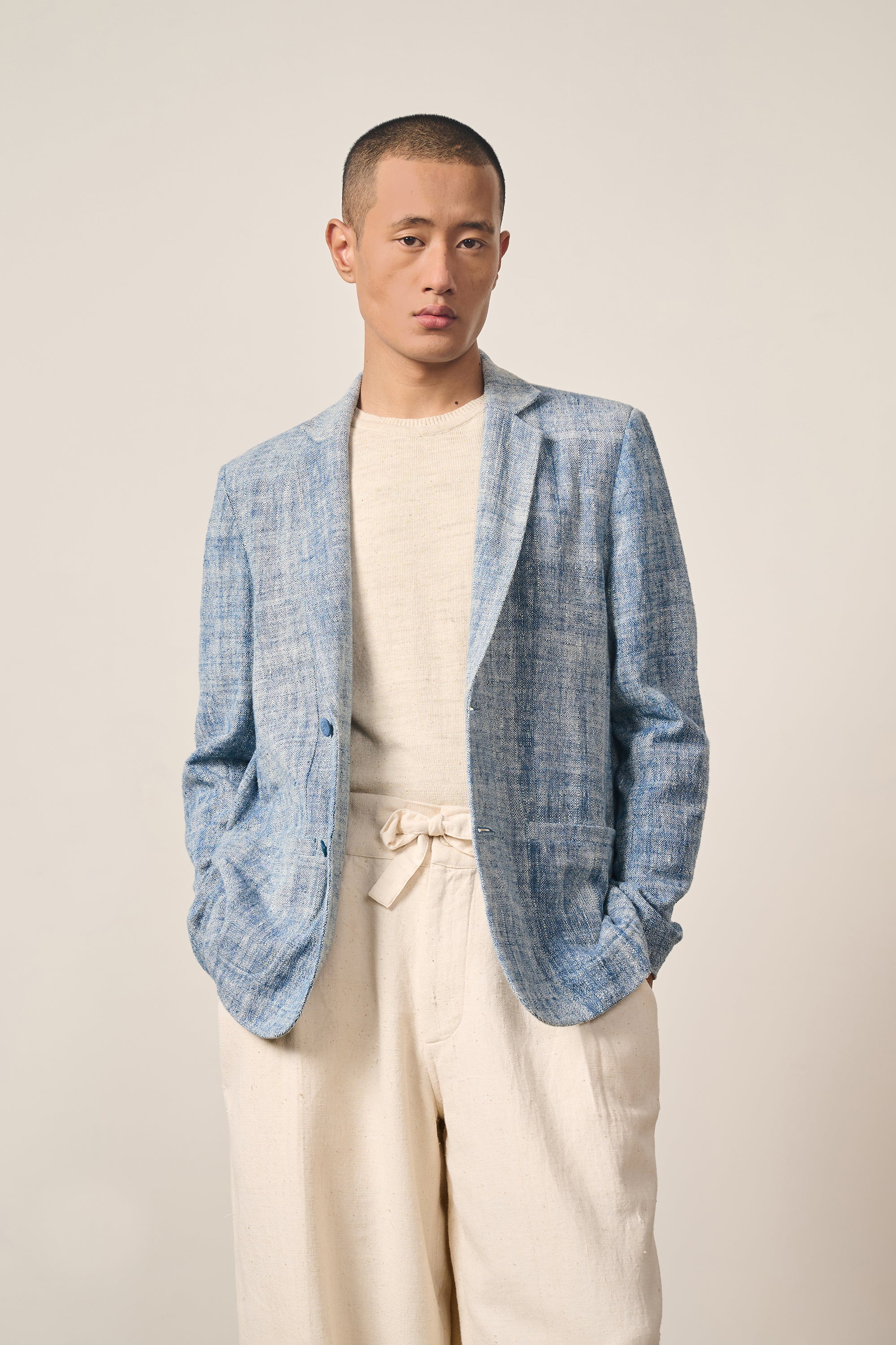 A man wearing medium indigo jacket