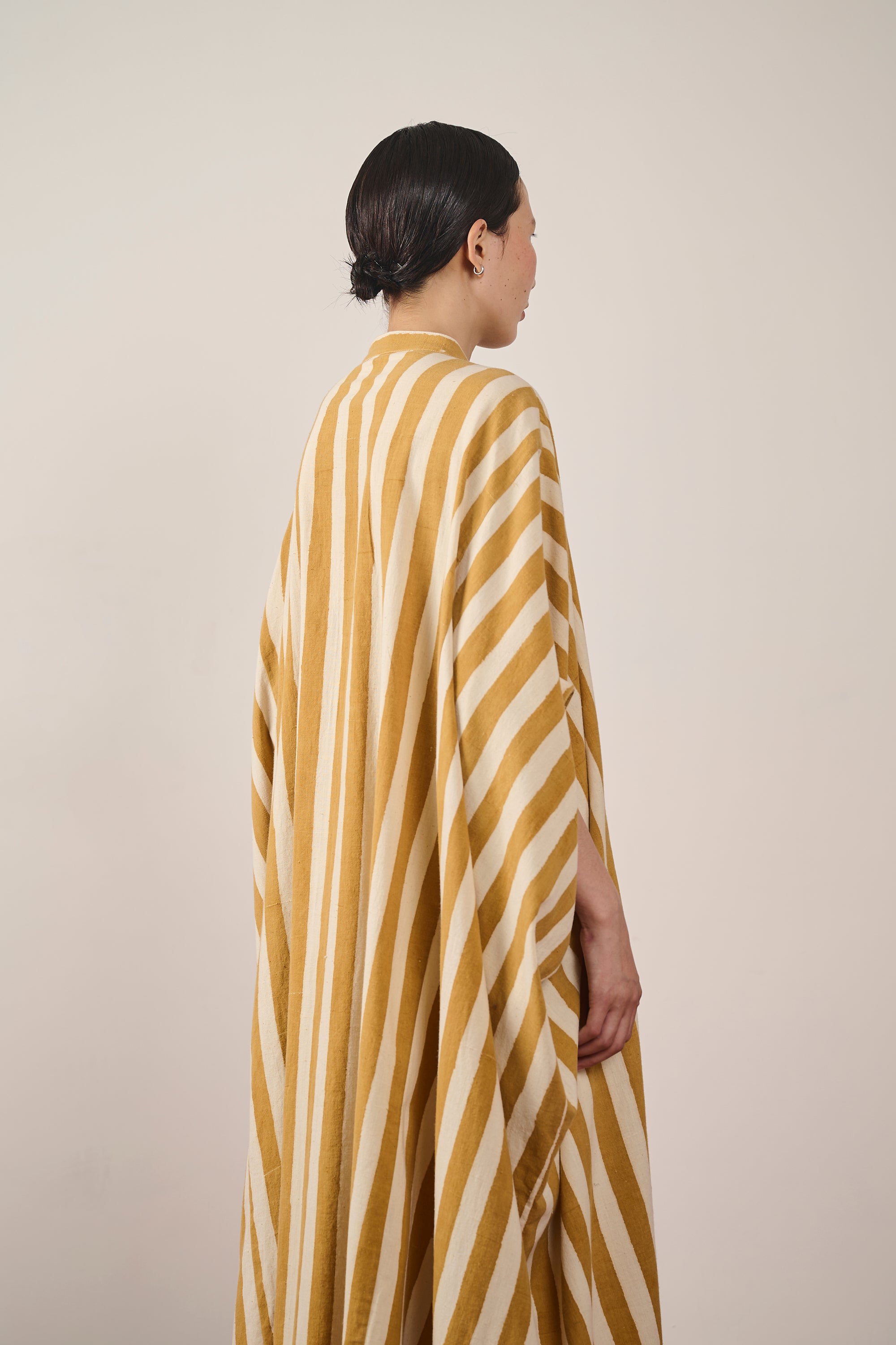 A back shot of a woman wearing cotton kaftan