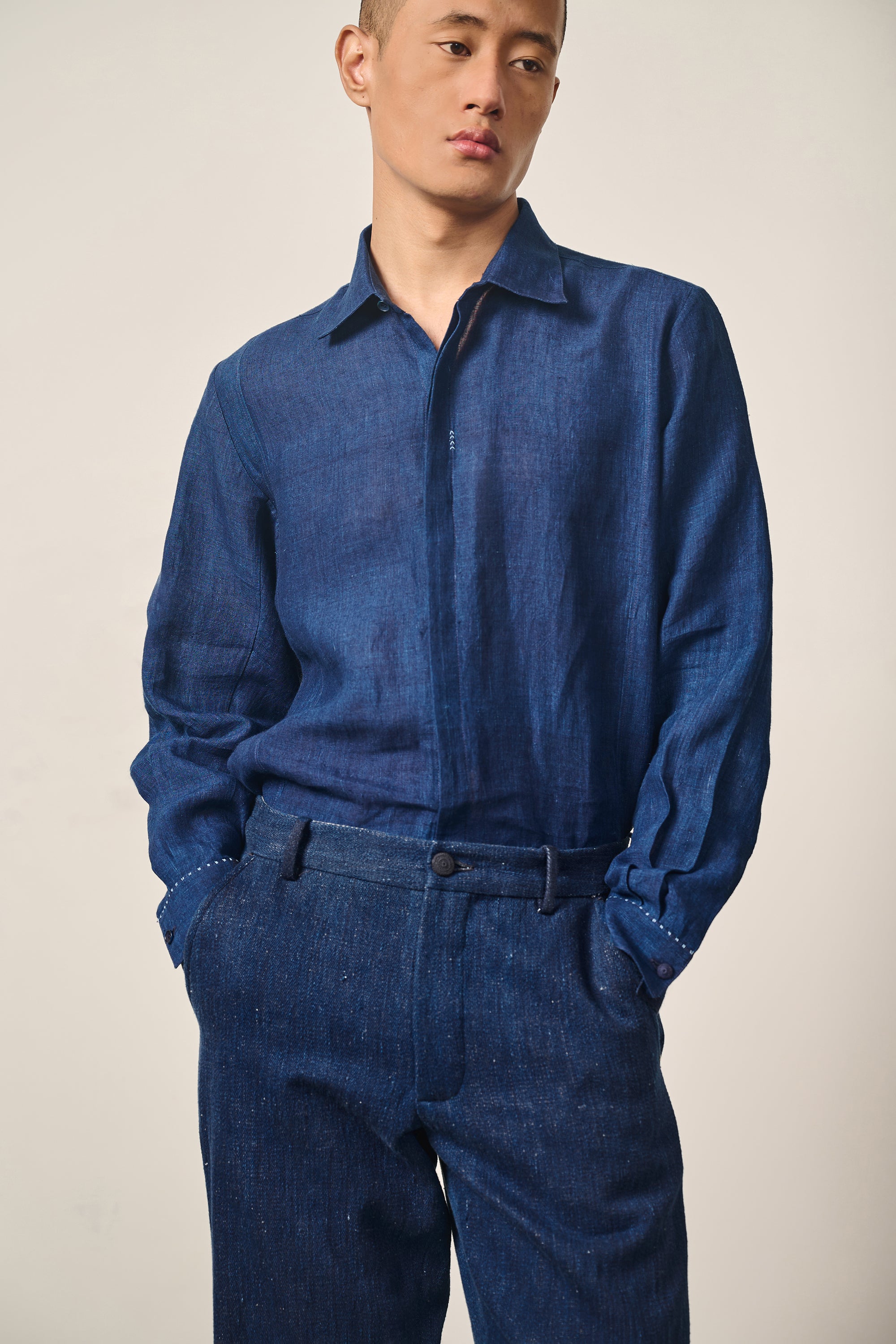 A man wearing indigo shirt