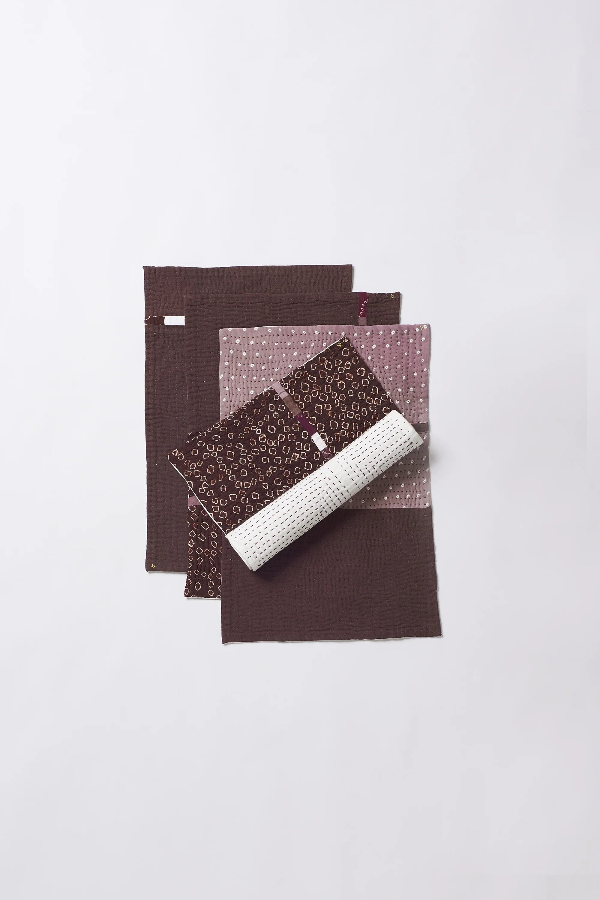 Colorful patterned fabric roll on a white background