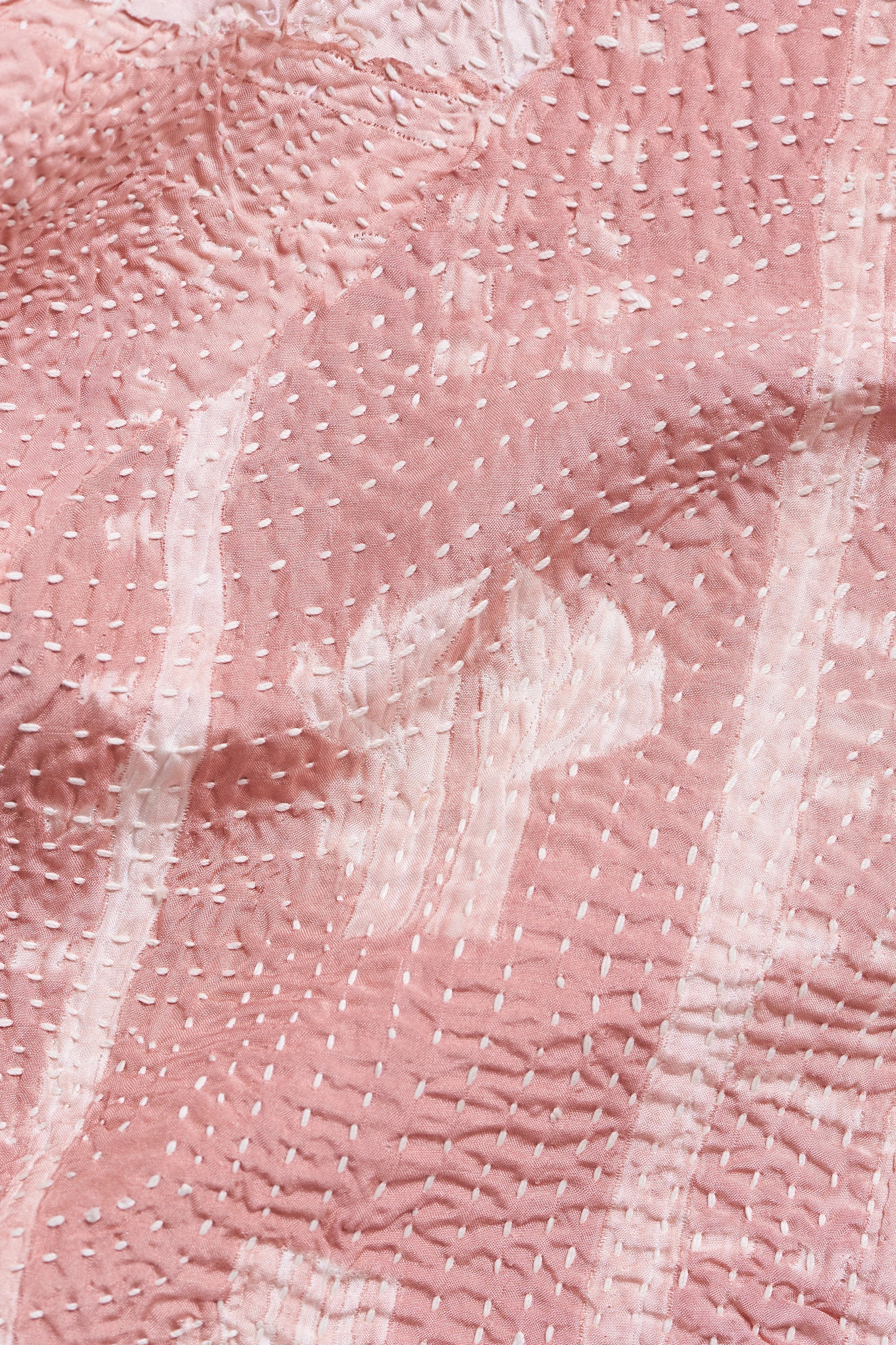 Close-up of fabric with kantha and patchwork