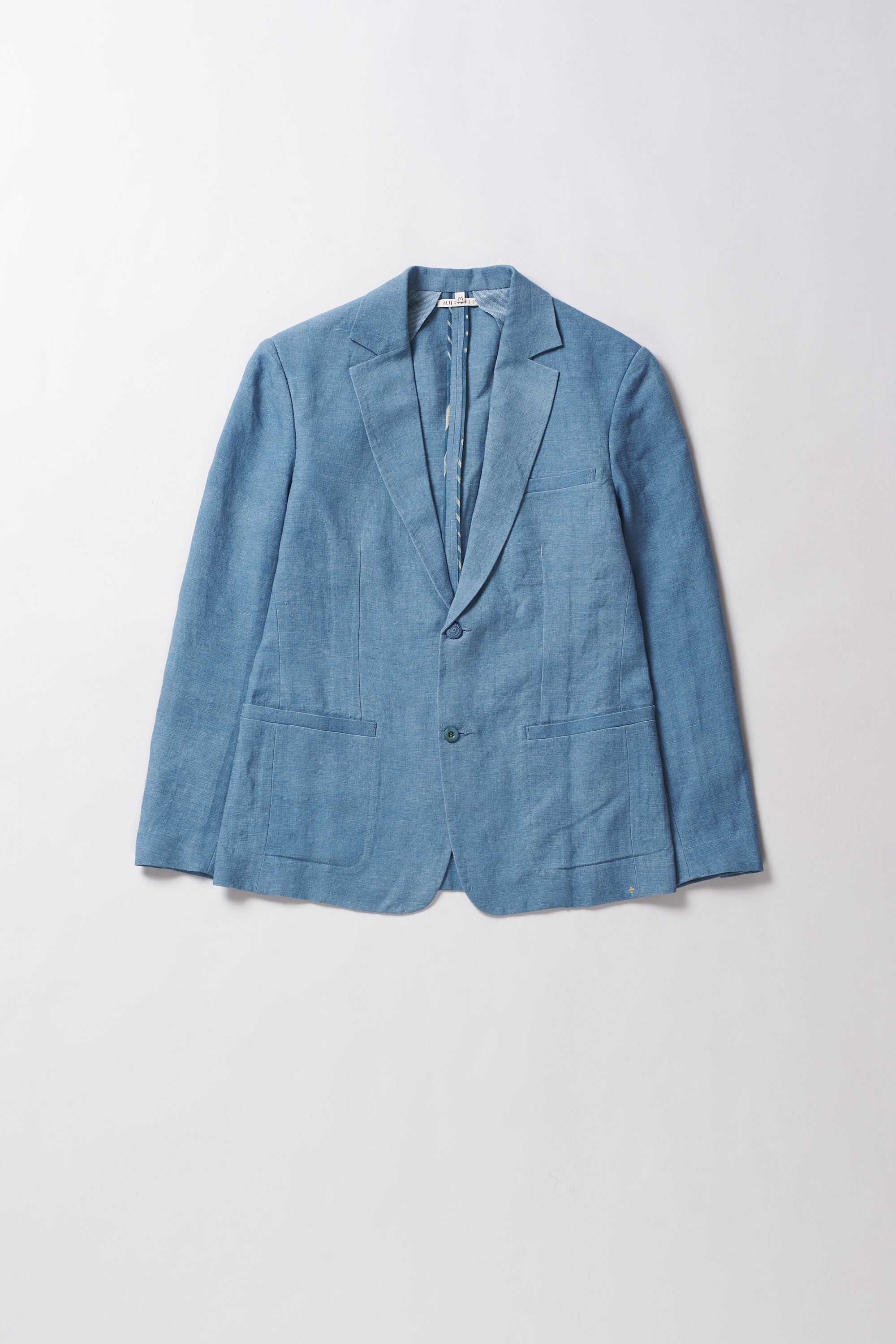 Blue jacket on a light grey background