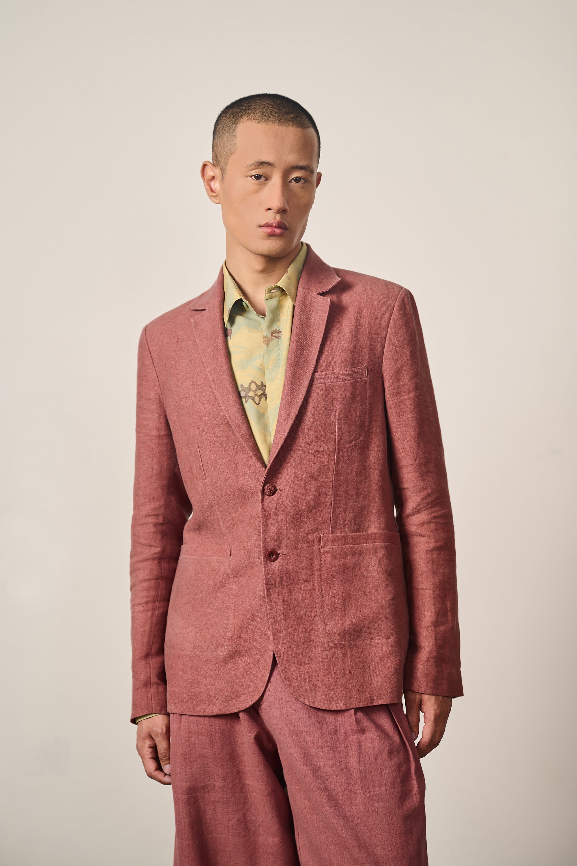 A man wearing rouge pink jacket