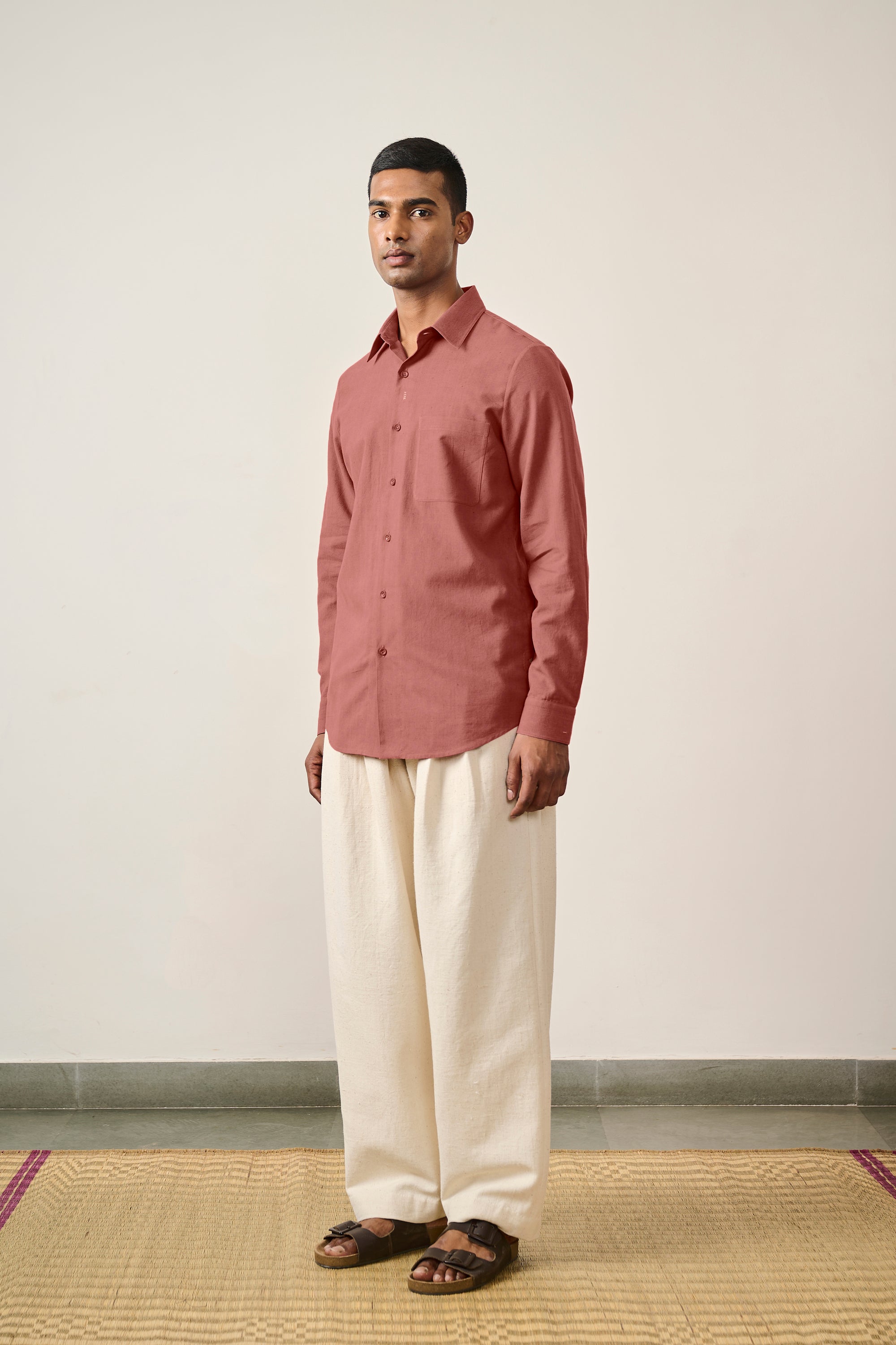 A man wearing cotton rouge pink shirt