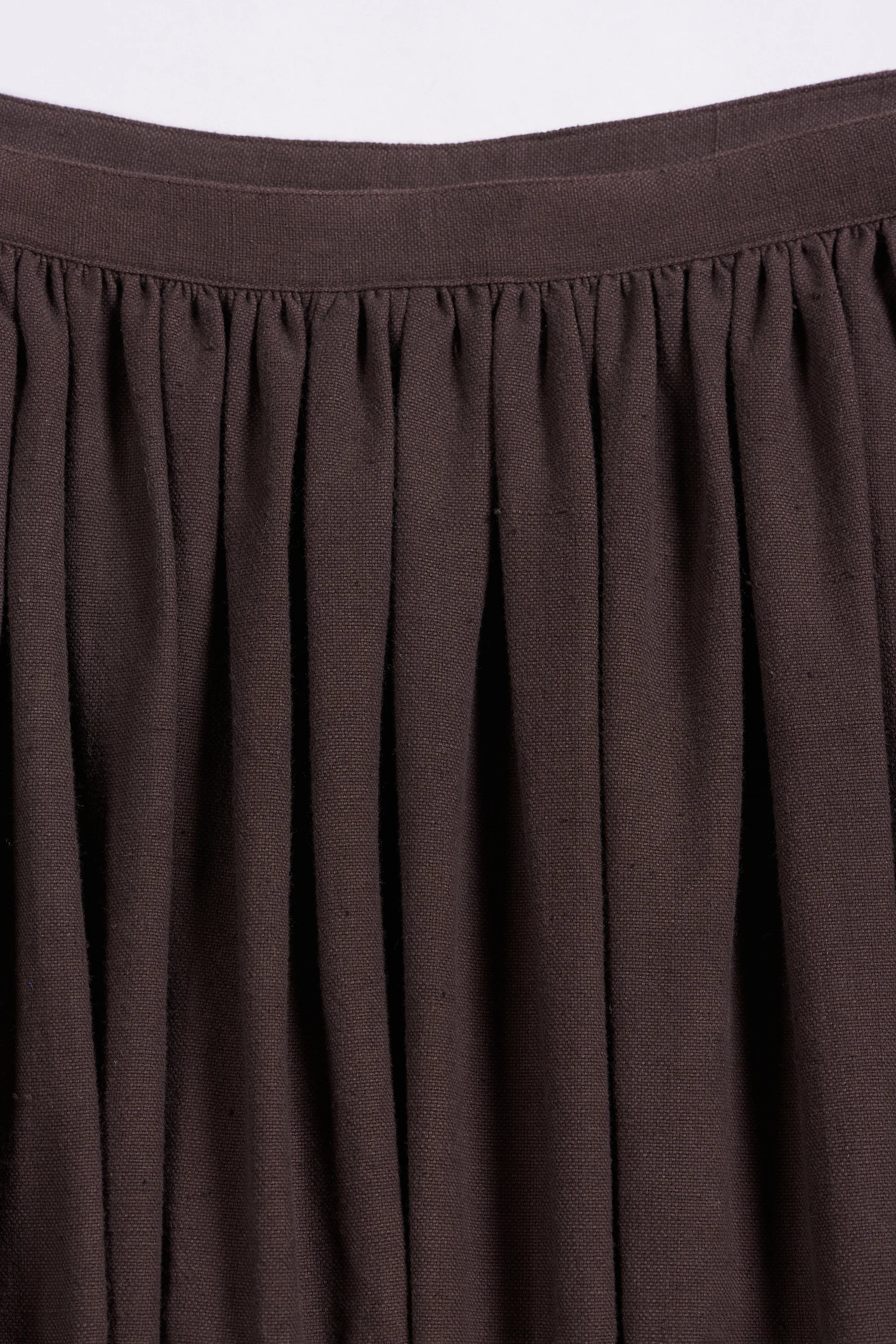 Close-up of burnt umber skirt
