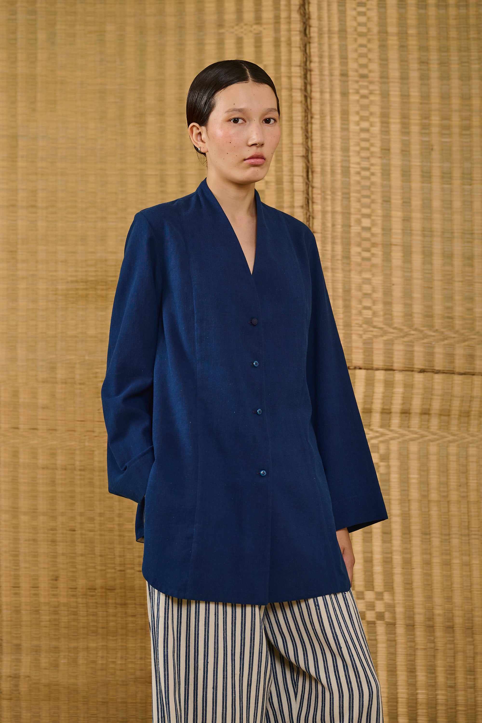 A woman wearing indigo cotton shirt