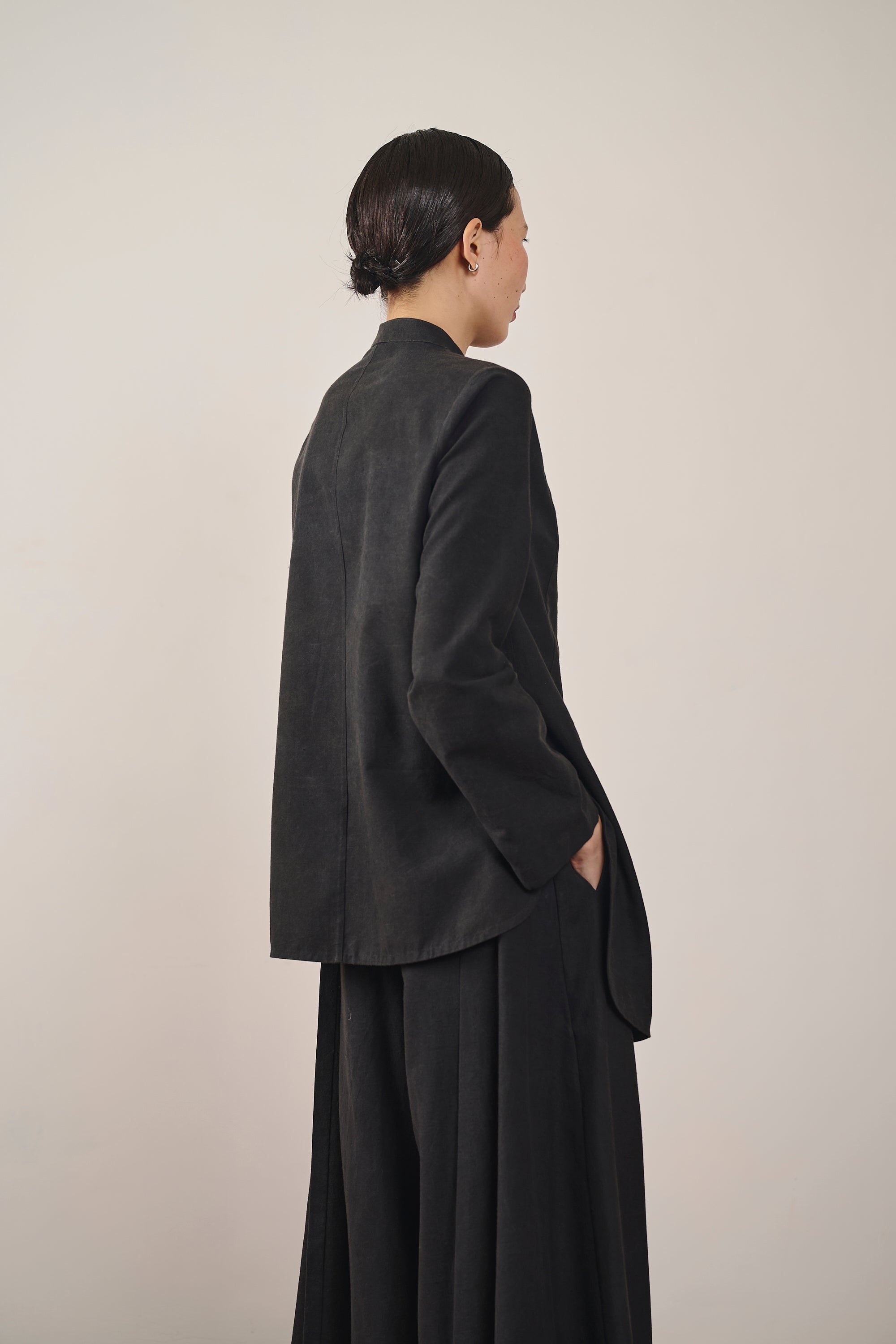 A side shot of a woman wearing black shirt