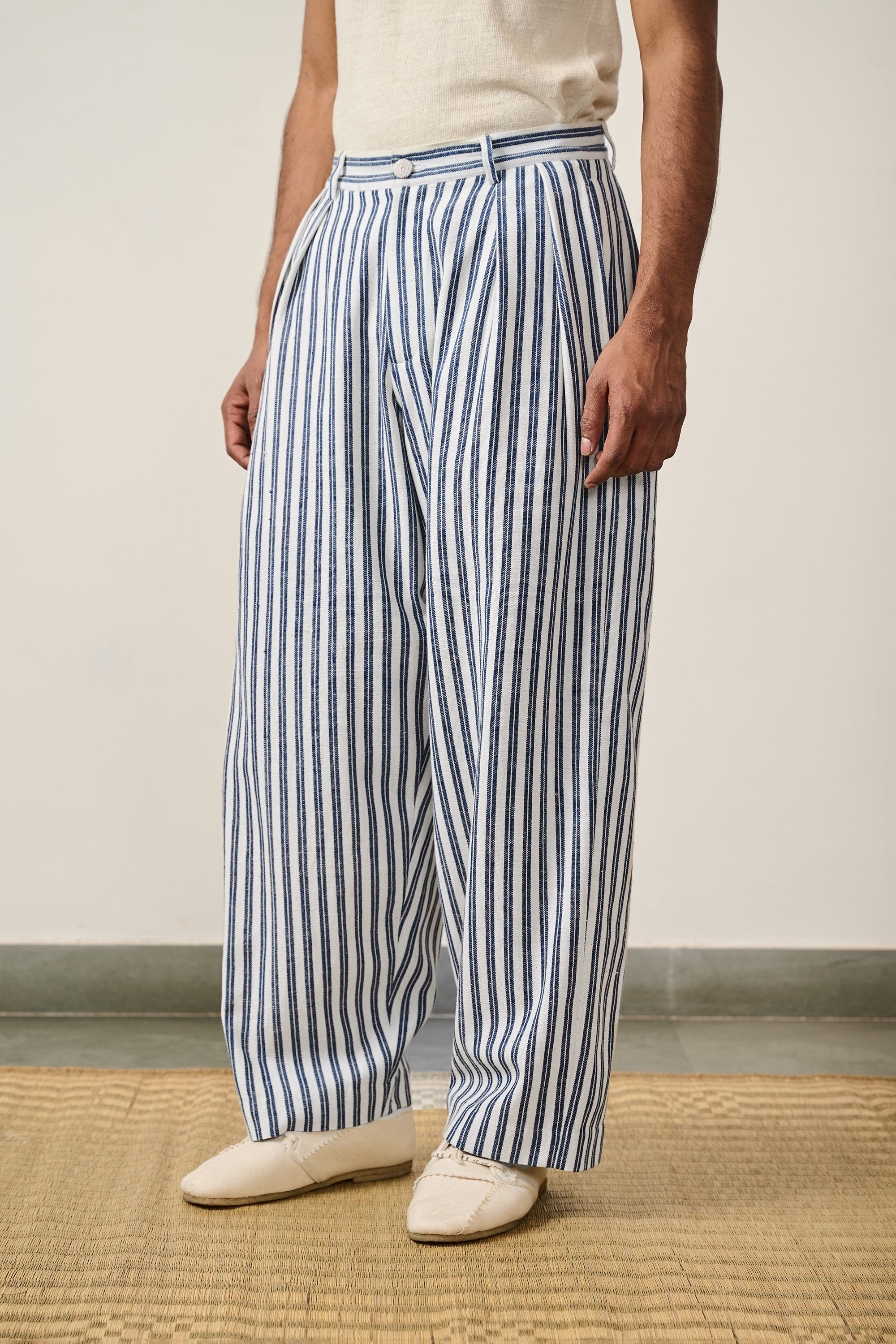 A man wearing medium indigo cotton pant