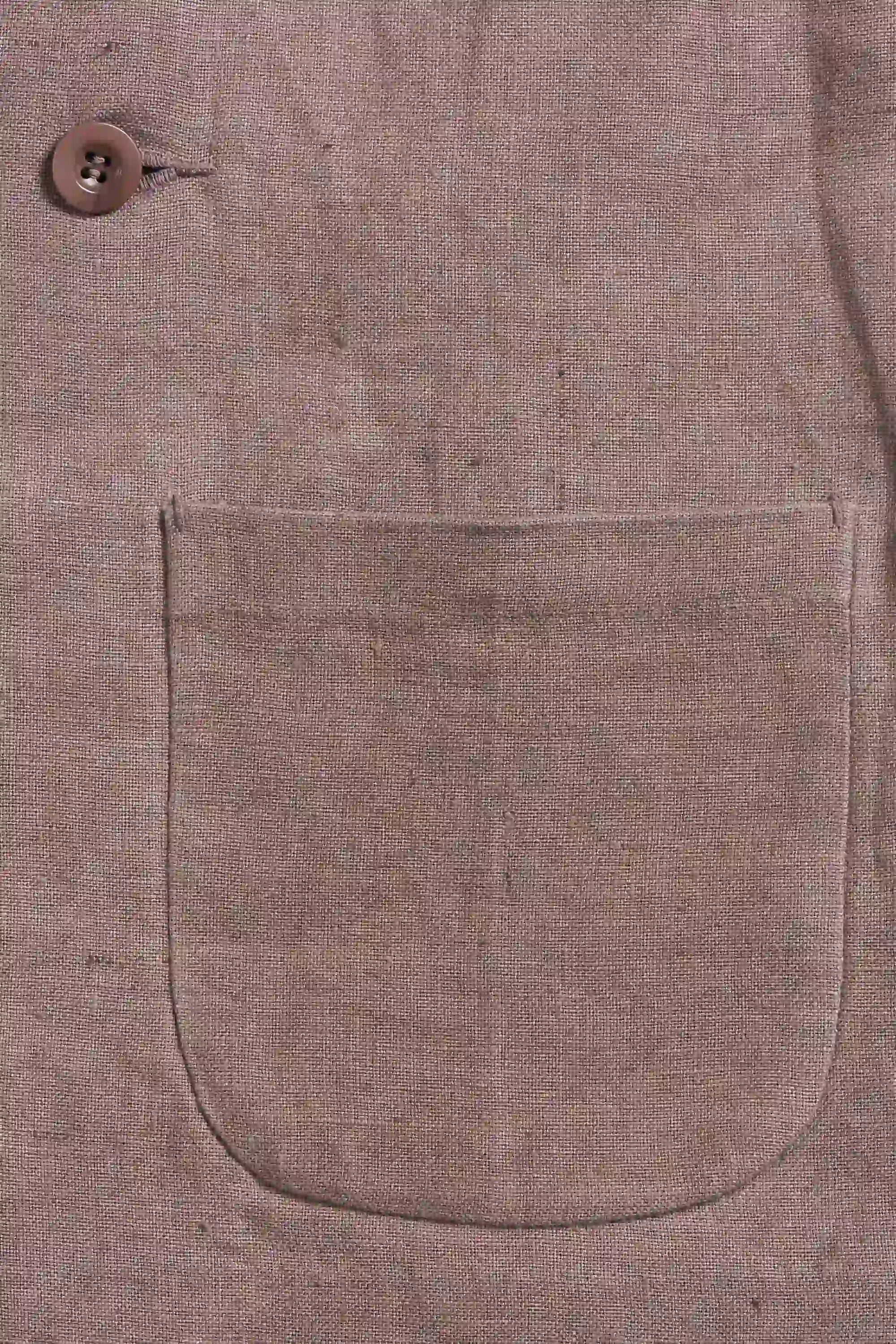 A woman wearing old rose linen jacket