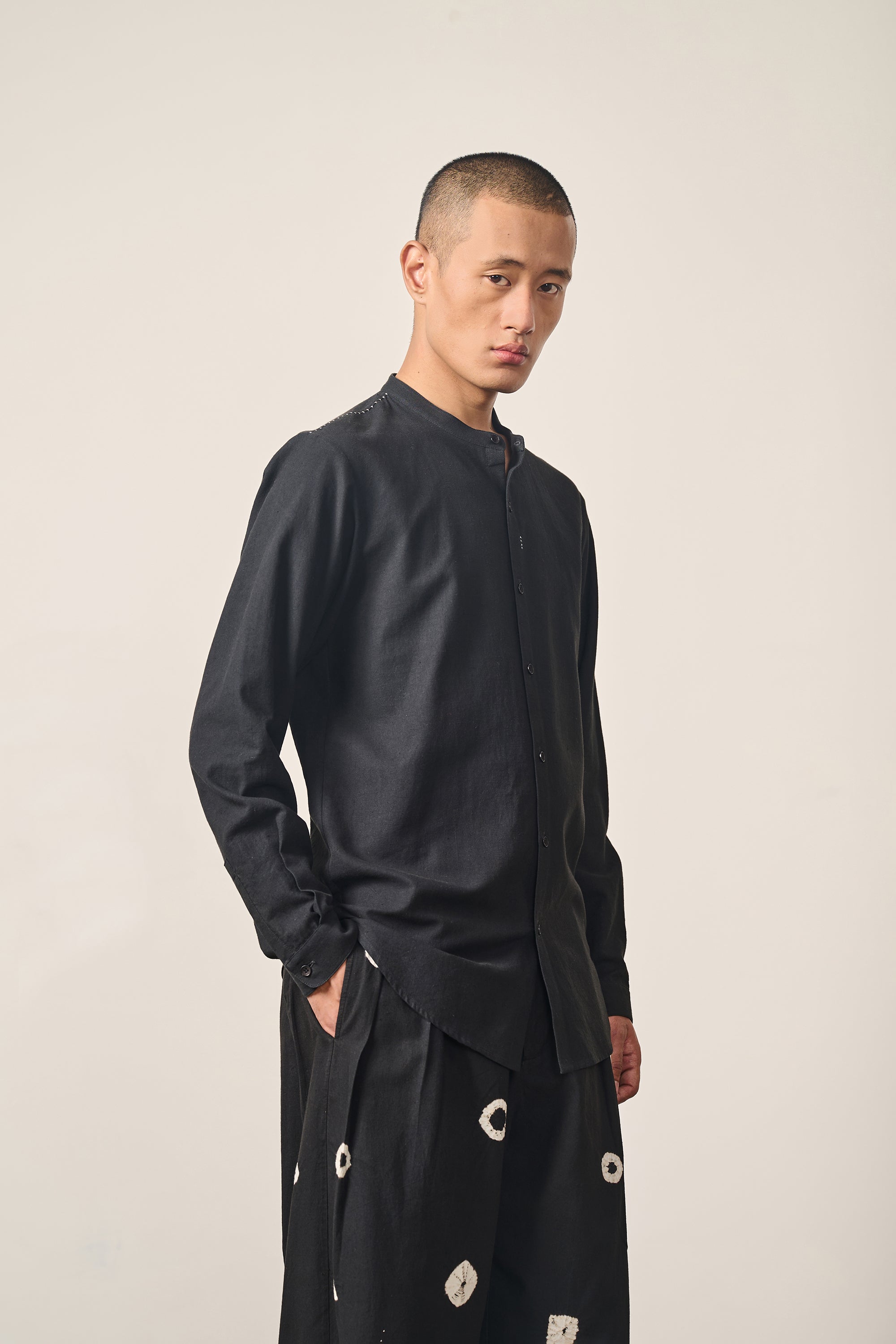 A man wearing black cotton shirt