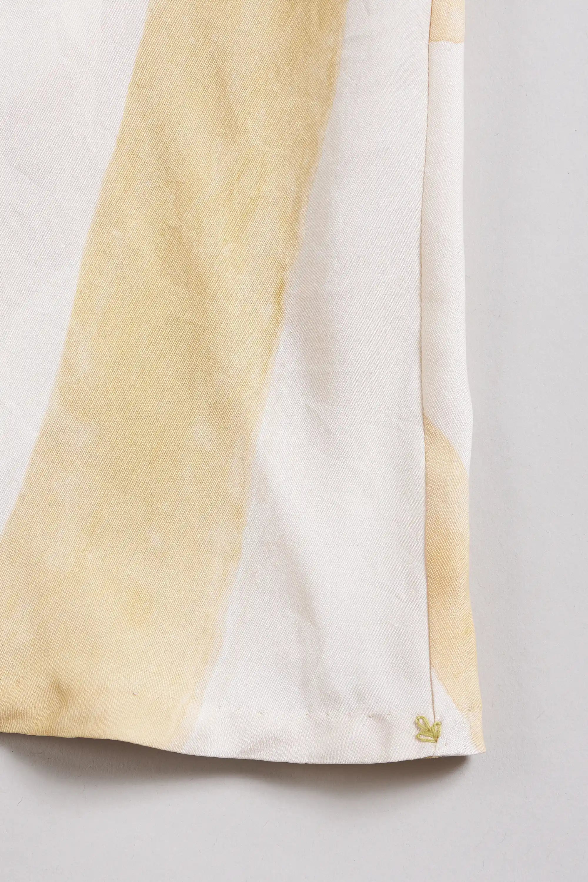 Fabric close-up with small yellow pehchan