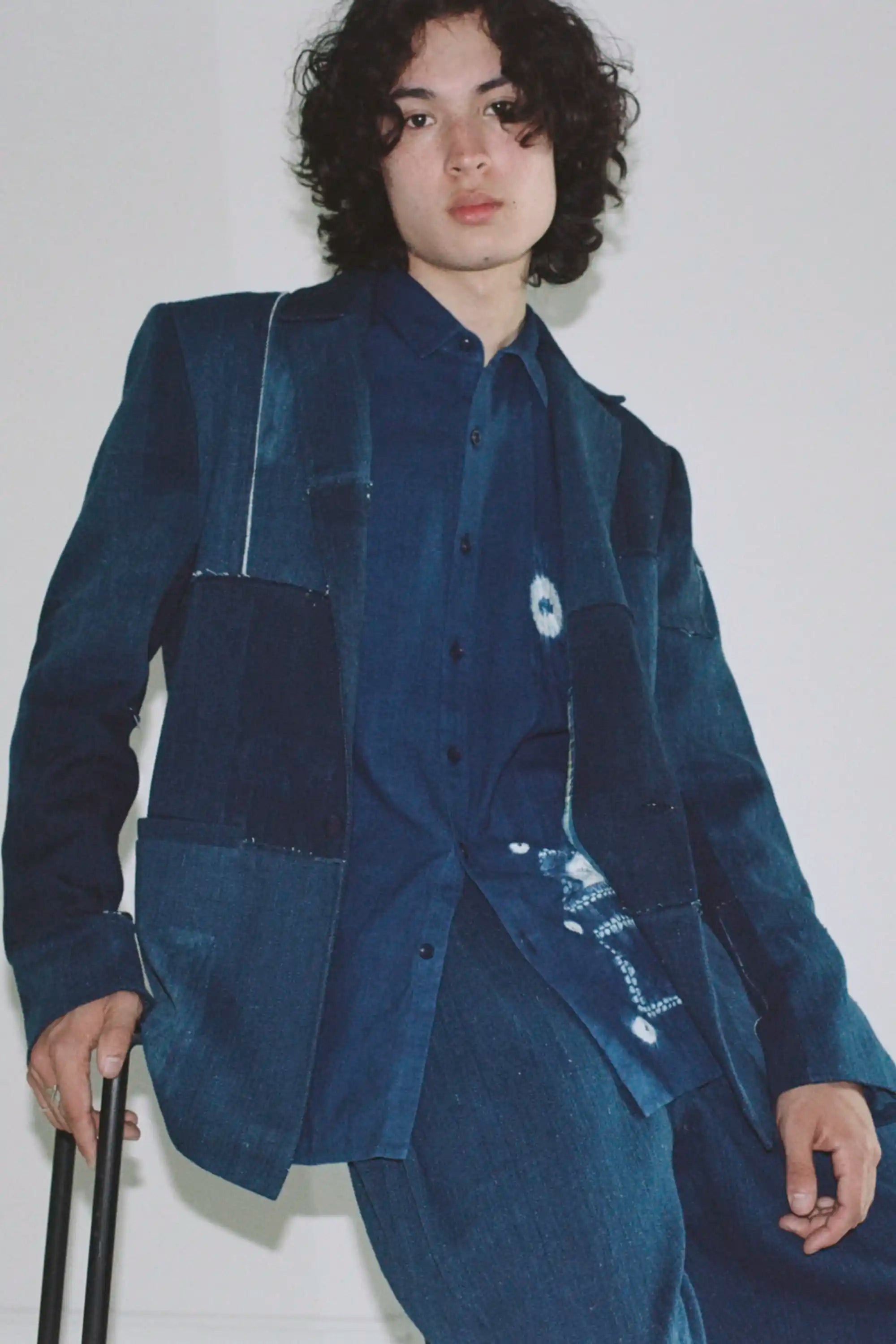 A man wearing medium indigo shirt