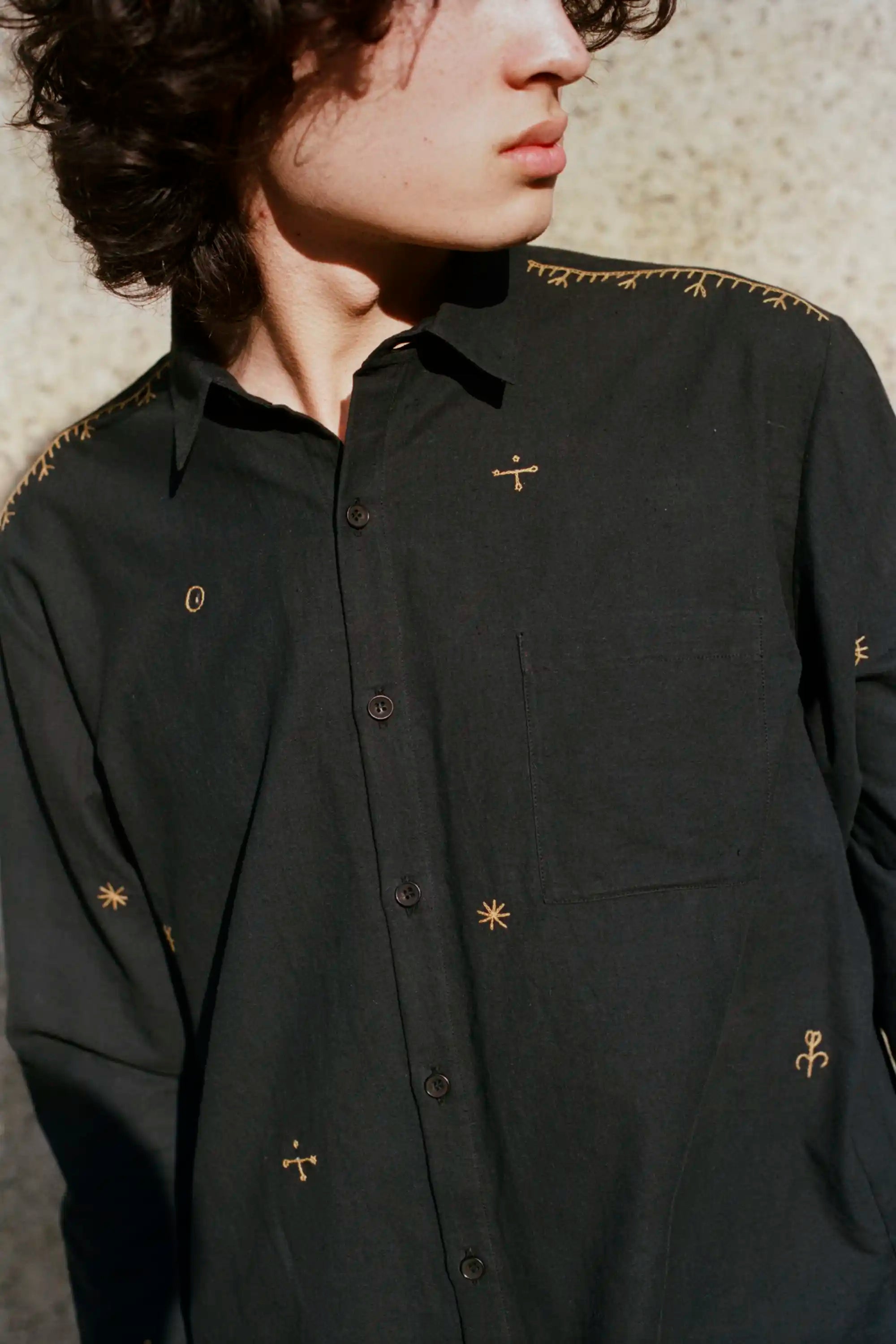 A man wearing midnight indigo cotton shirt