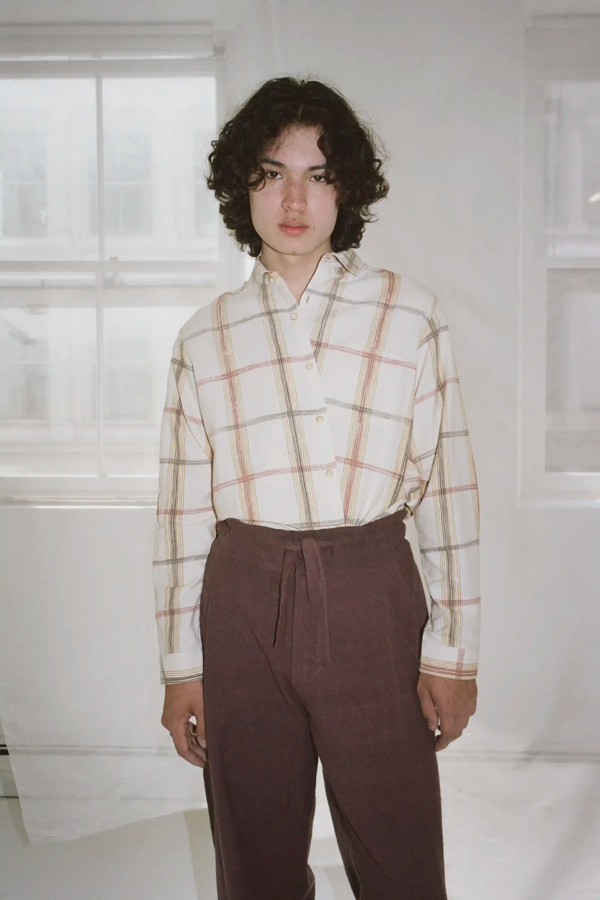 A man wearing cream shirt