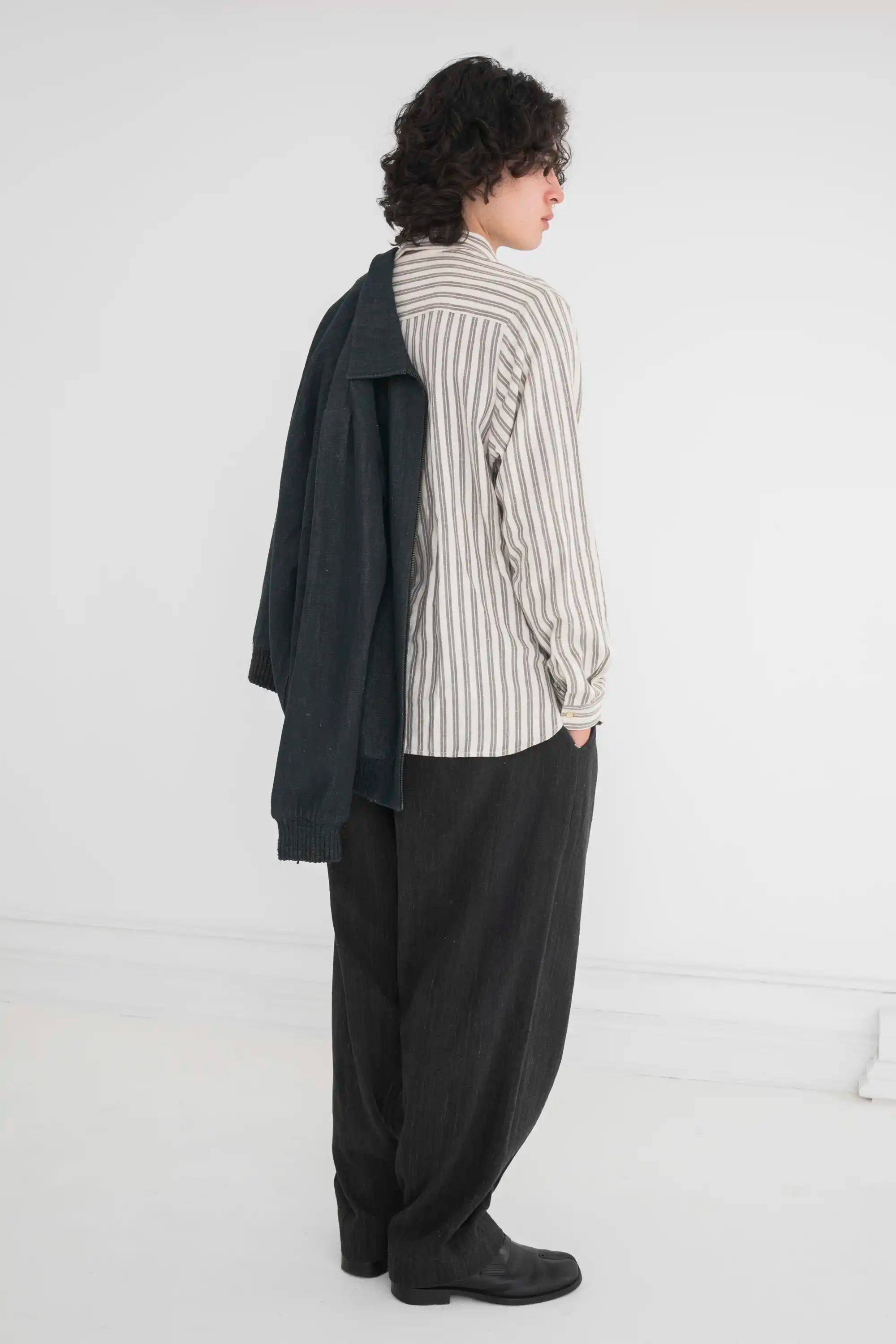 A man wearing midnight indigo cotton denim pant