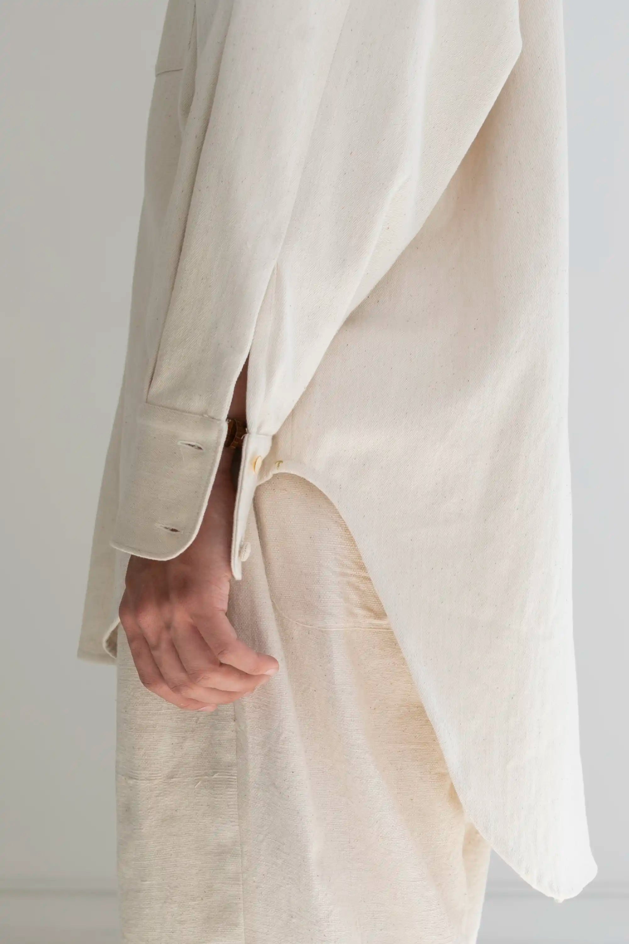 A man wearing ecru cotton pant