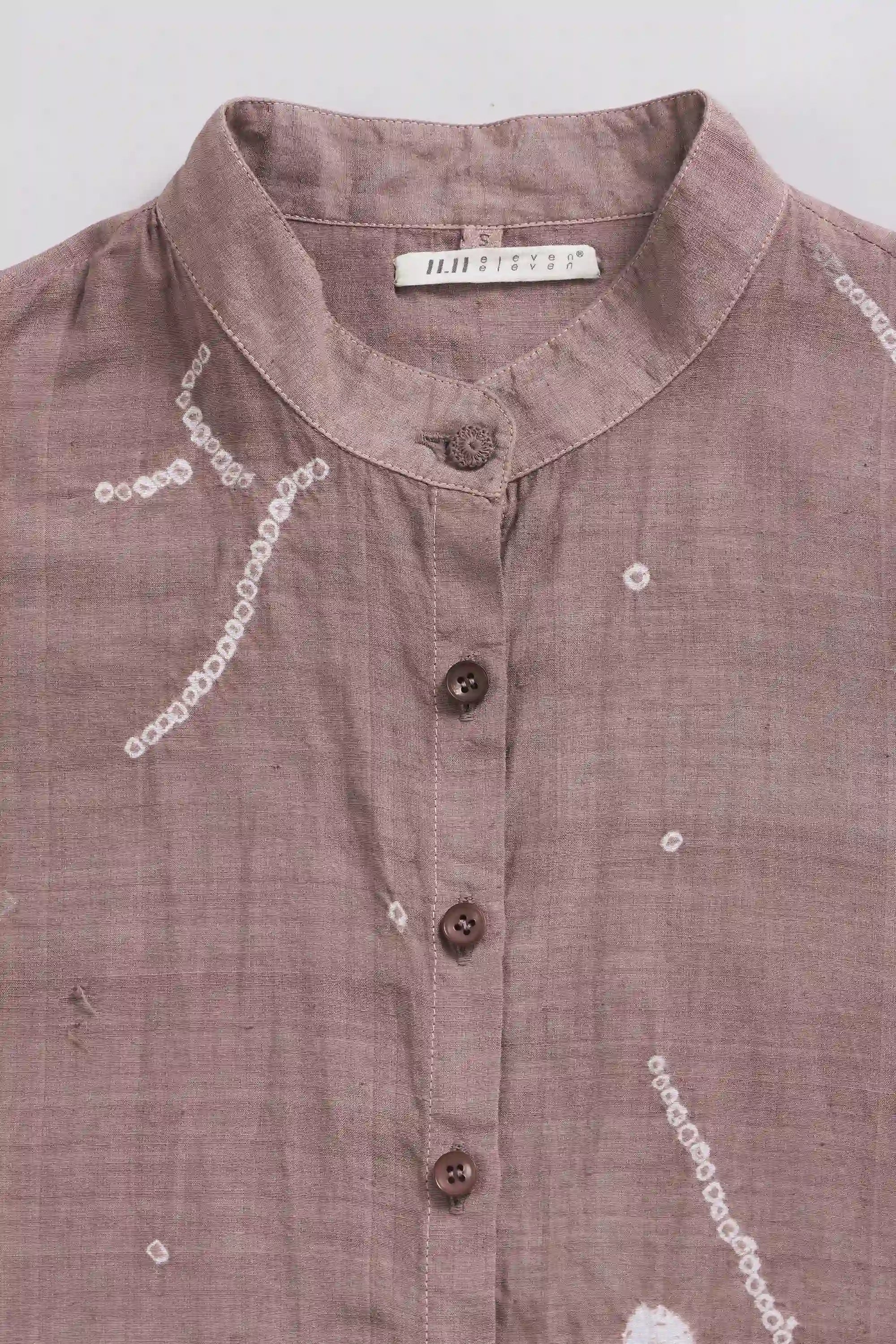 Fabric close-up with band collar and buttons