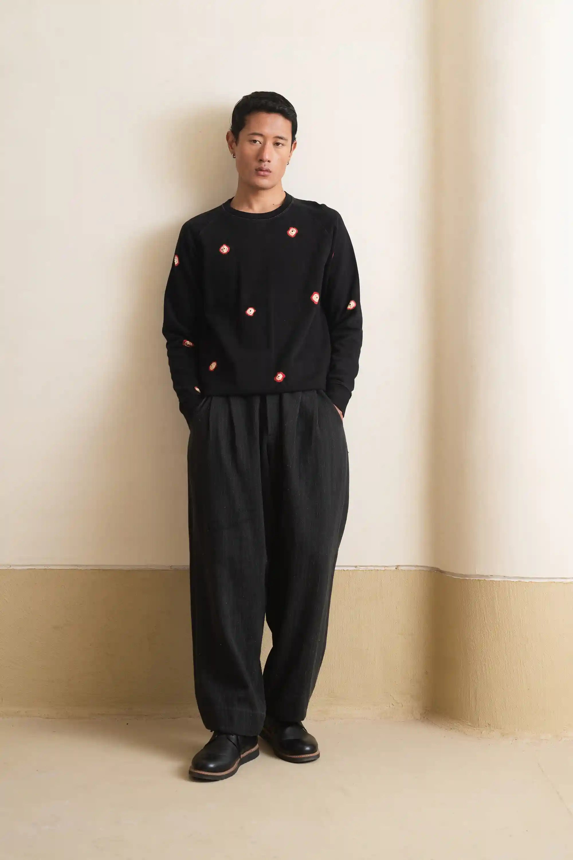 A man wearing black cotton sweatshirt
