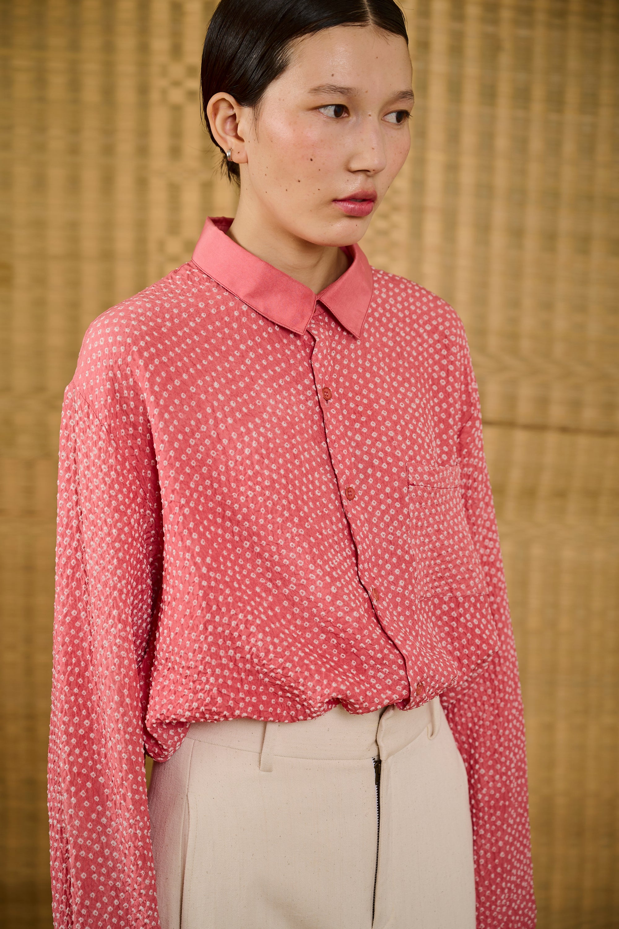 A woman wearing pink wood shirt