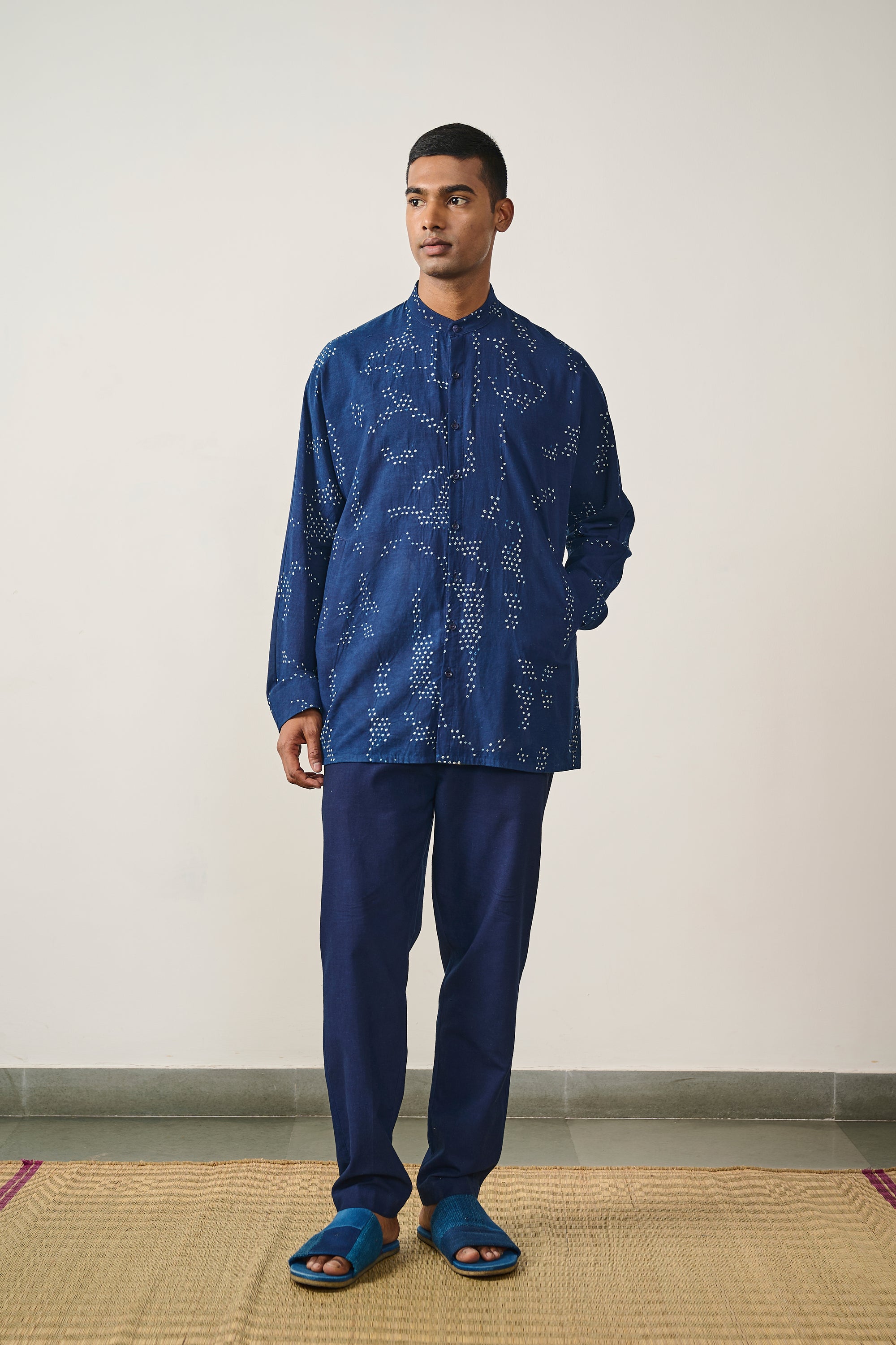 A man wearing indigo bandhani cotton shirt
