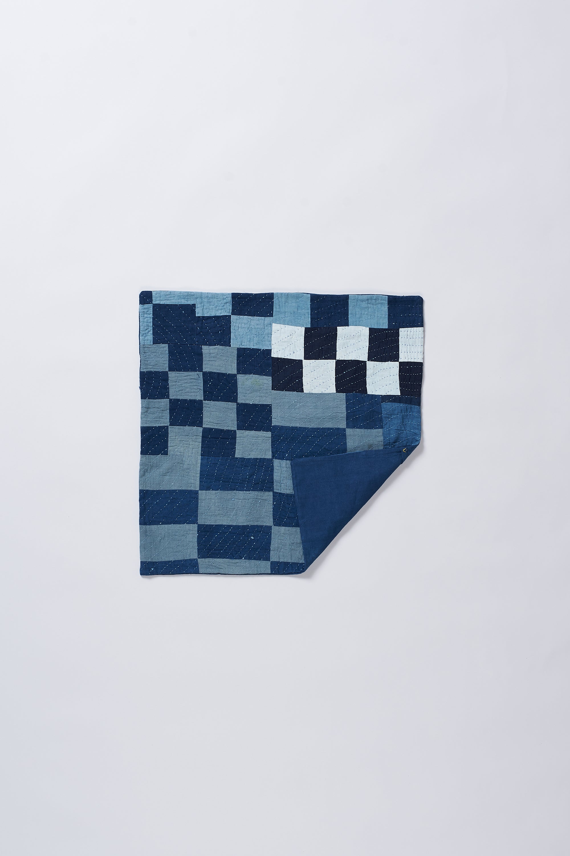 Blue  pillow case with geometric pattern on a white background