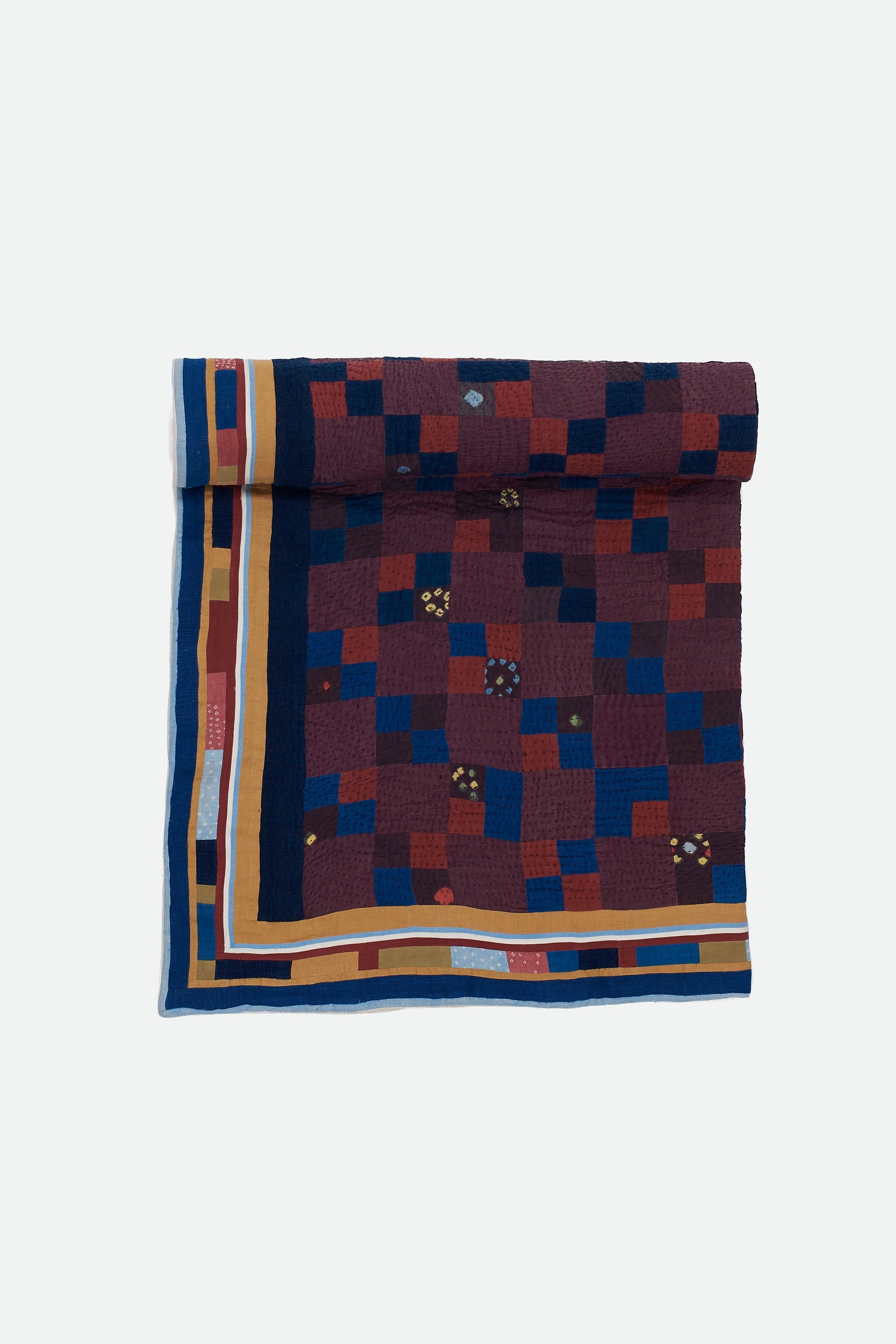 Colorful patterned fabric roll on a white background