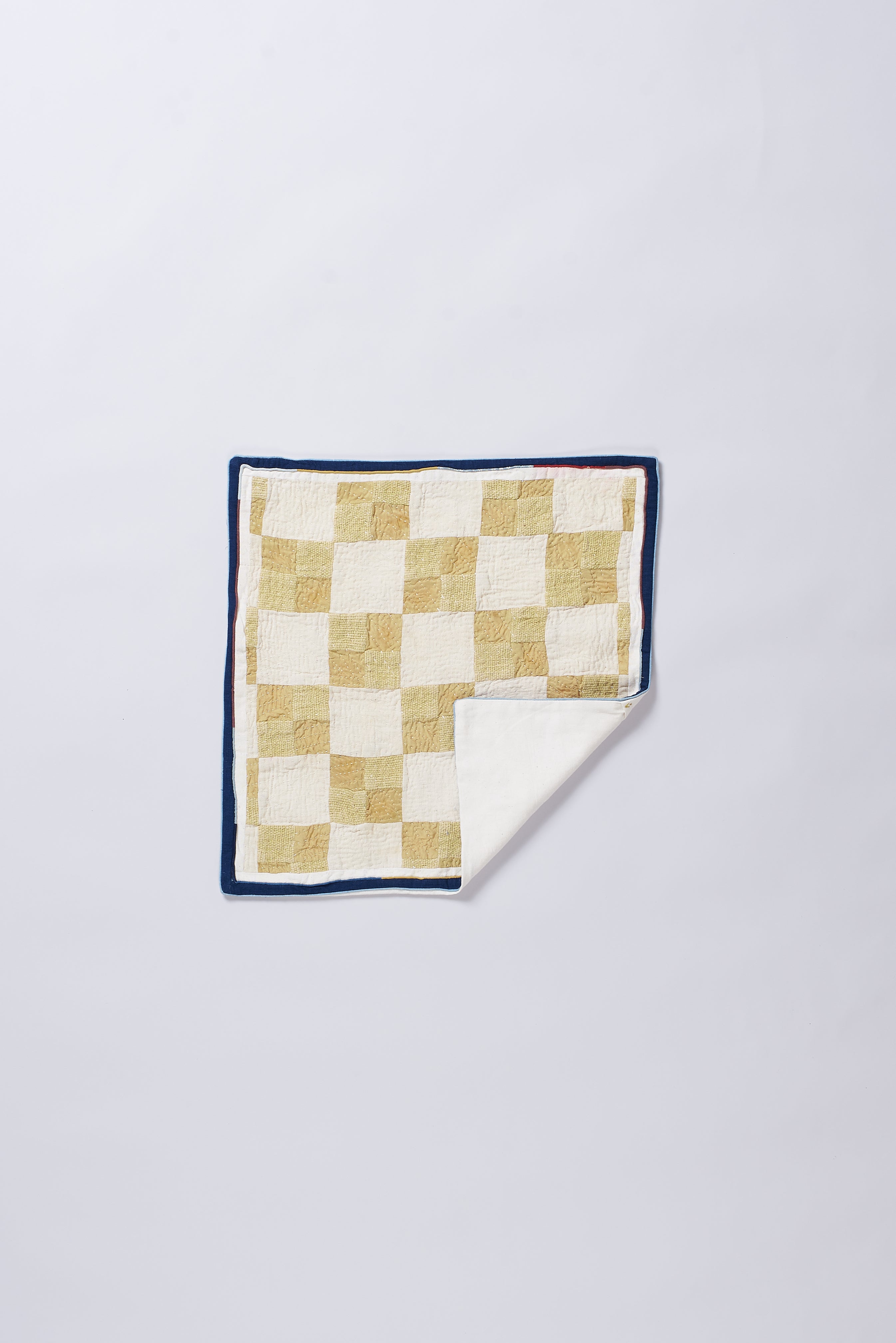 Ecru  pillow case with geometric pattern on a white background