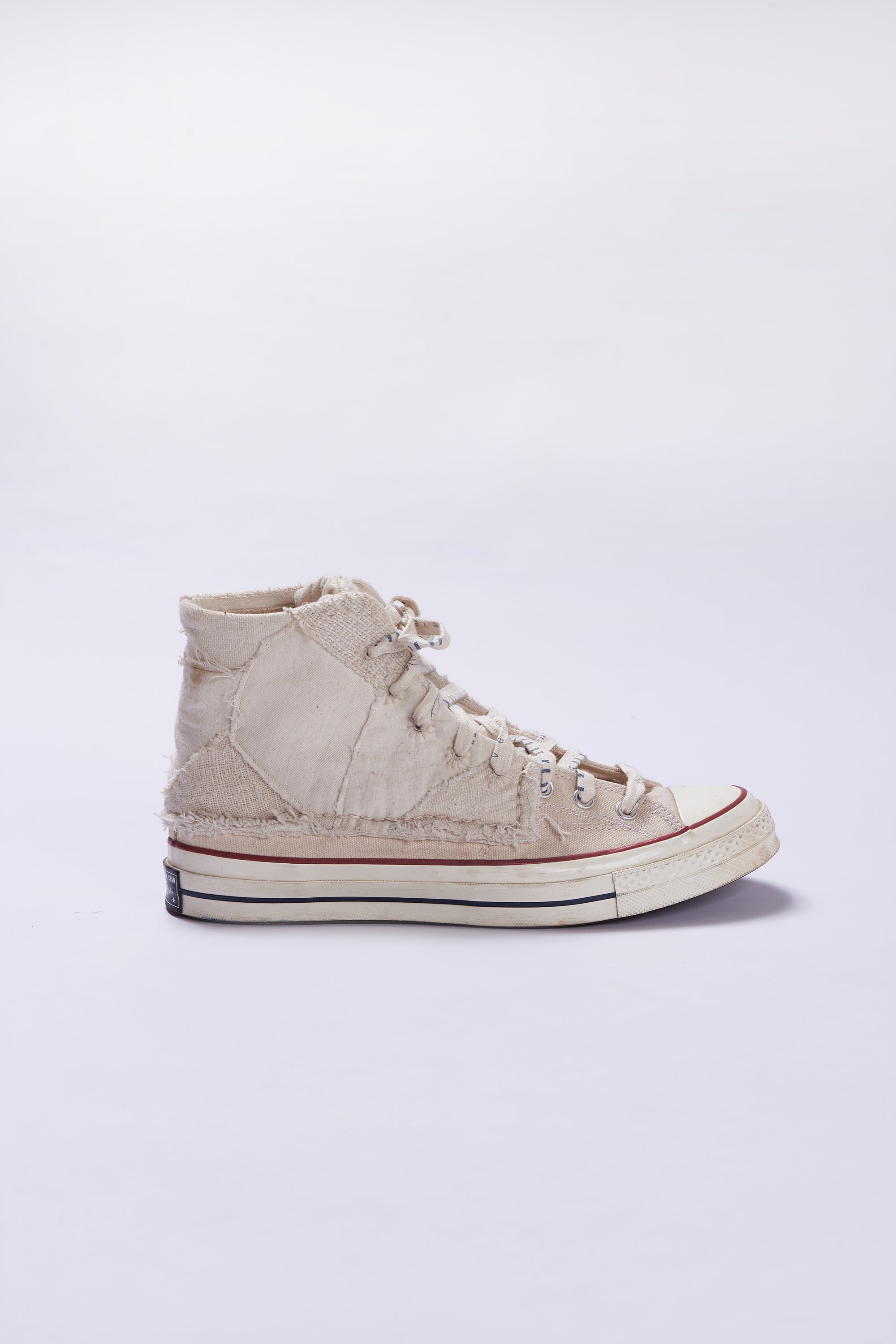 A side image of a ecru shoes