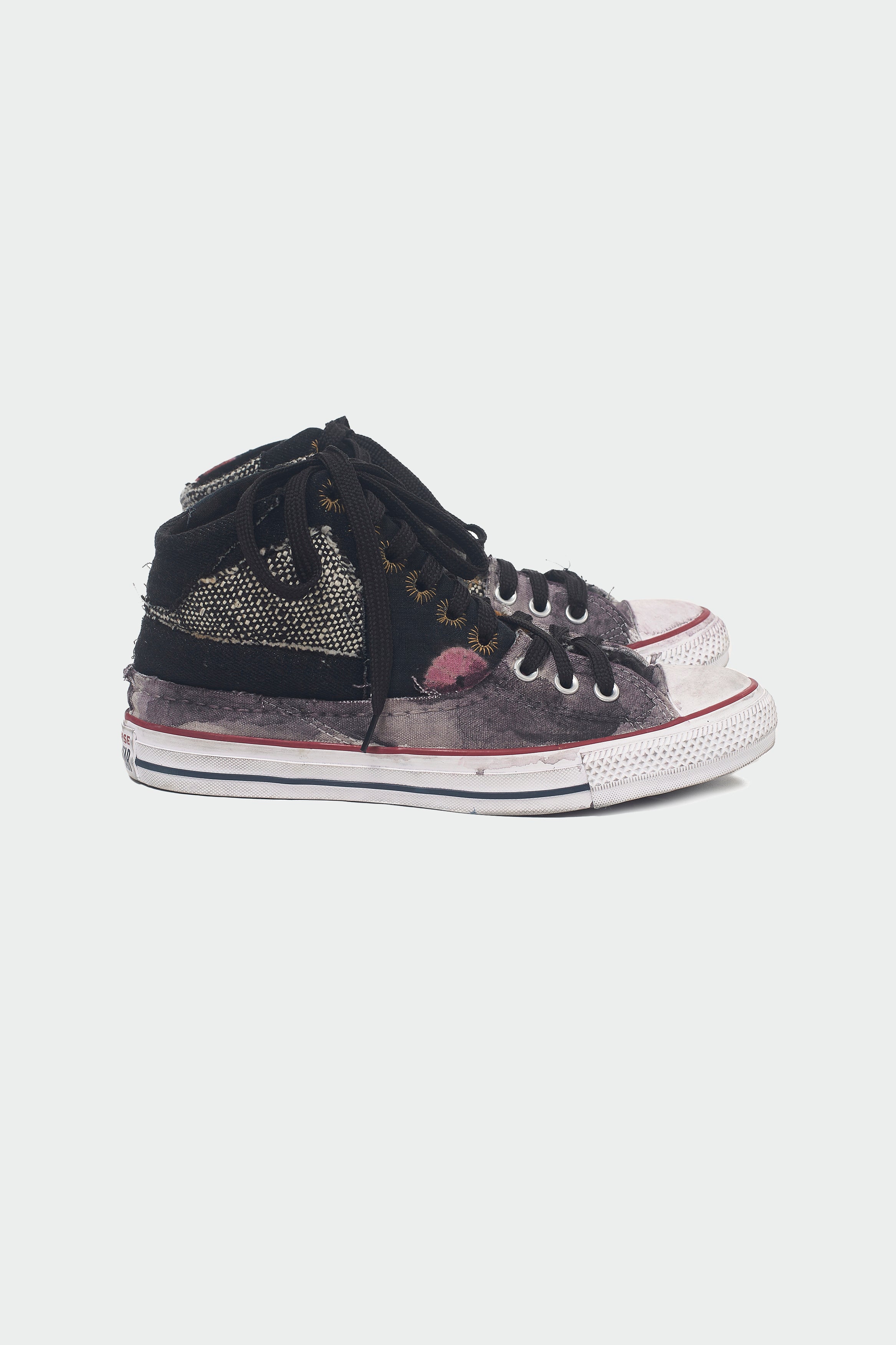 Side shot of a black converse shoes