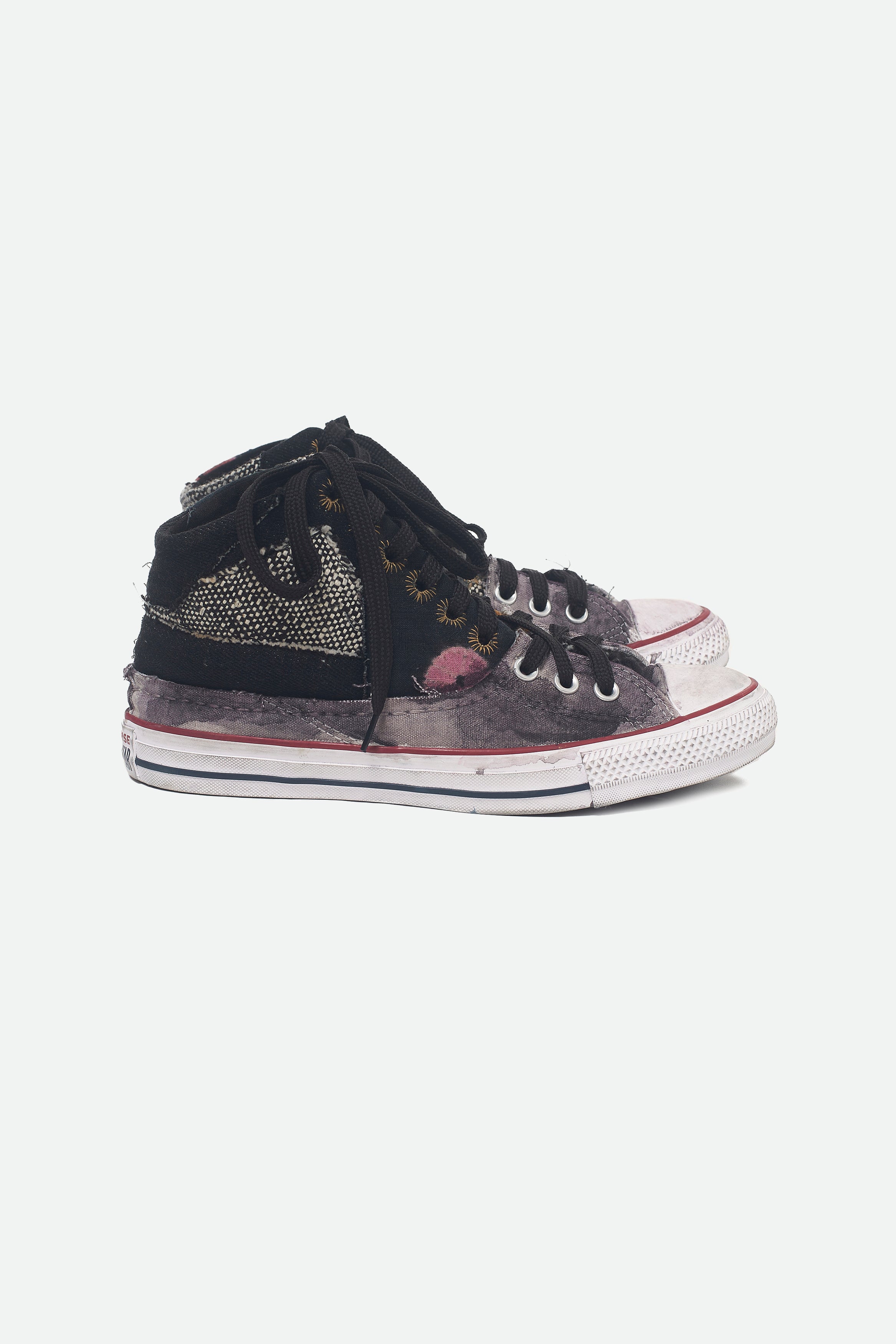 Side shot of a black converse shoes